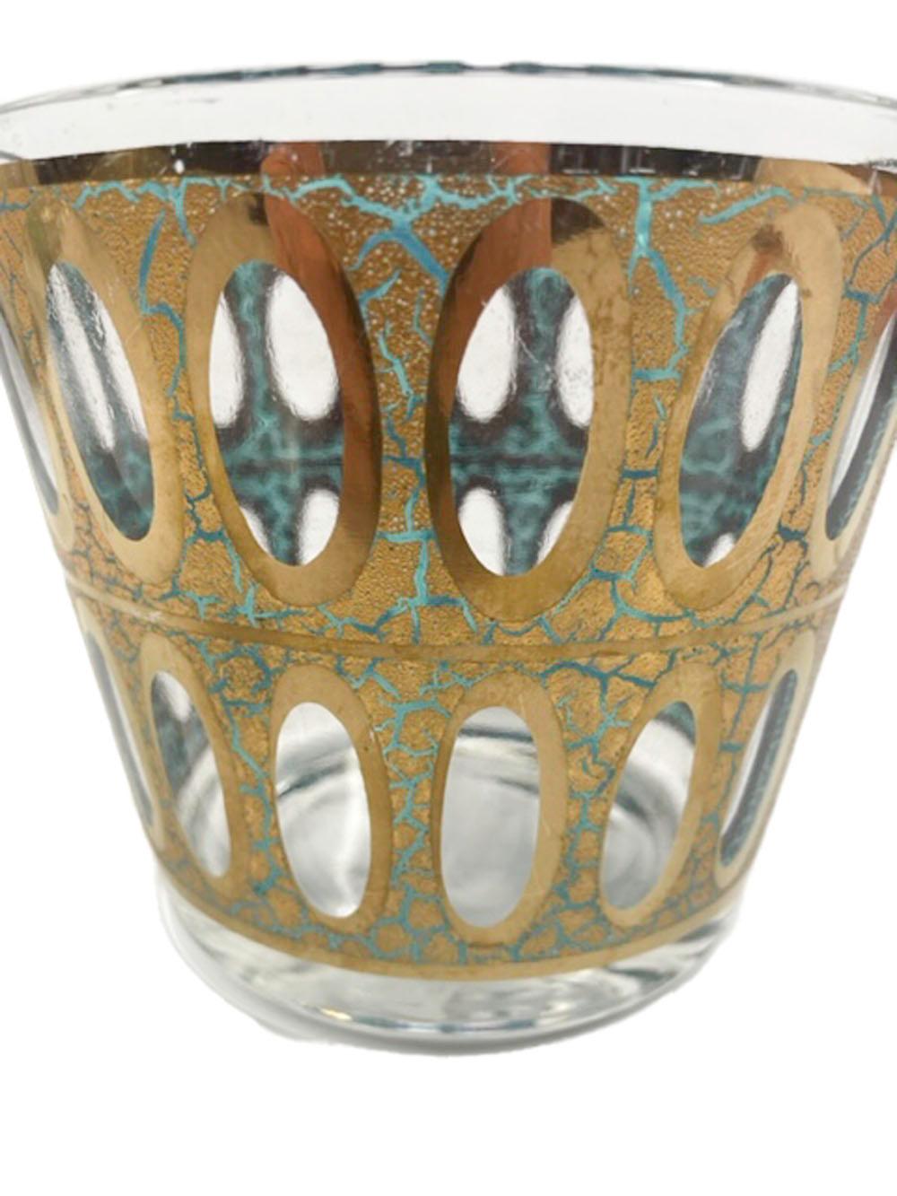 Mid-Century Modern ice bowl by Culver, Ltd., in the Pisa pattern having green translucent enamel below 22 karat gold with a crackled finish exposing the enamel on the exterior with the interior showing the enamel with the crackled gold highlighting