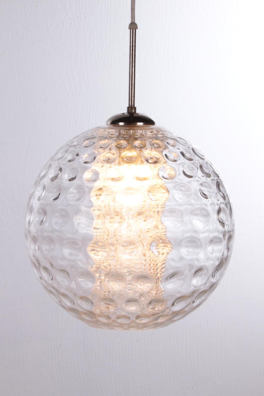 Vintage Ice Glass Ball Pendant Lamp by Doria Leuchten, 1960s

This is a beautiful crystal ball.

Made of glass, the outside is made of bubble glass and the cylinder inside is made of ice glass.

The cylinder contains a lamp with an E27 fitting. A
