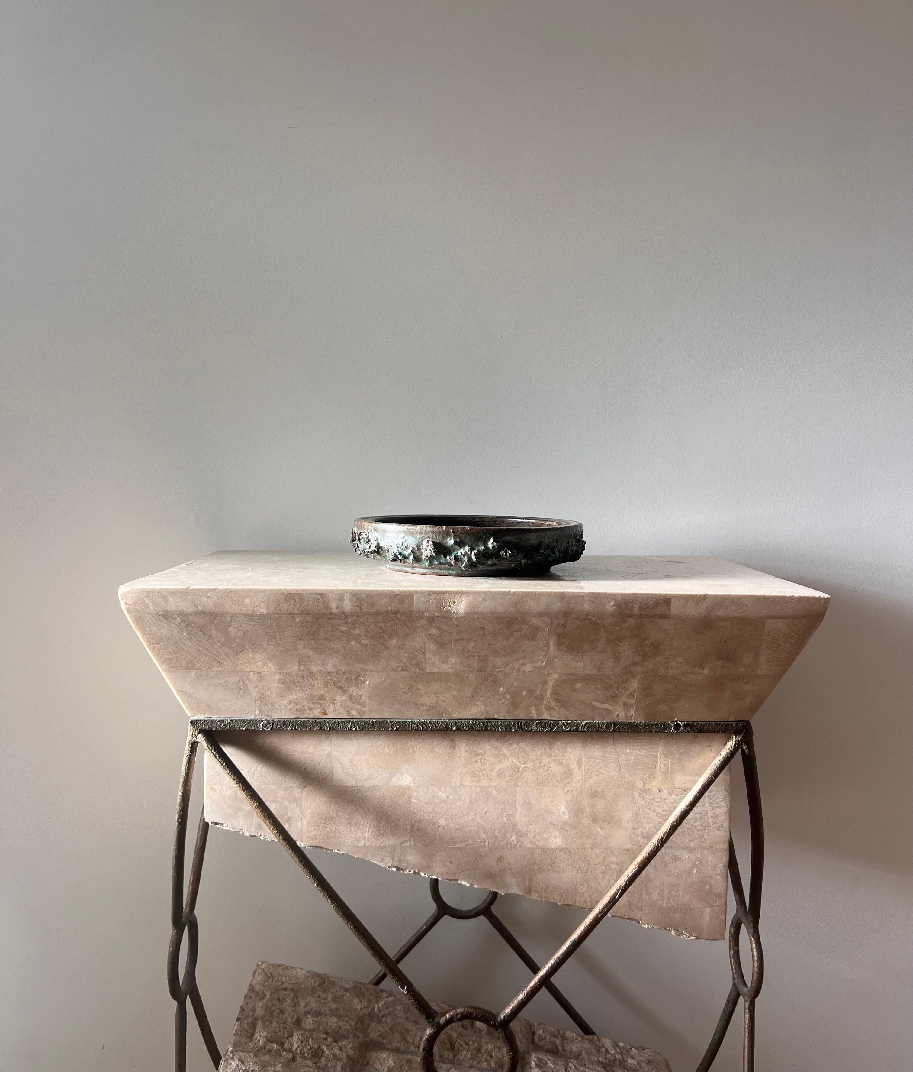 A Glit Lava ashtray in tones of pewter and swimming pool blue, Iceland late 20th century. Measuring nearly nine inches in diameter, and furnished at the edge with a unique textured motif, this large vessel can function as an ashtray, catchall,