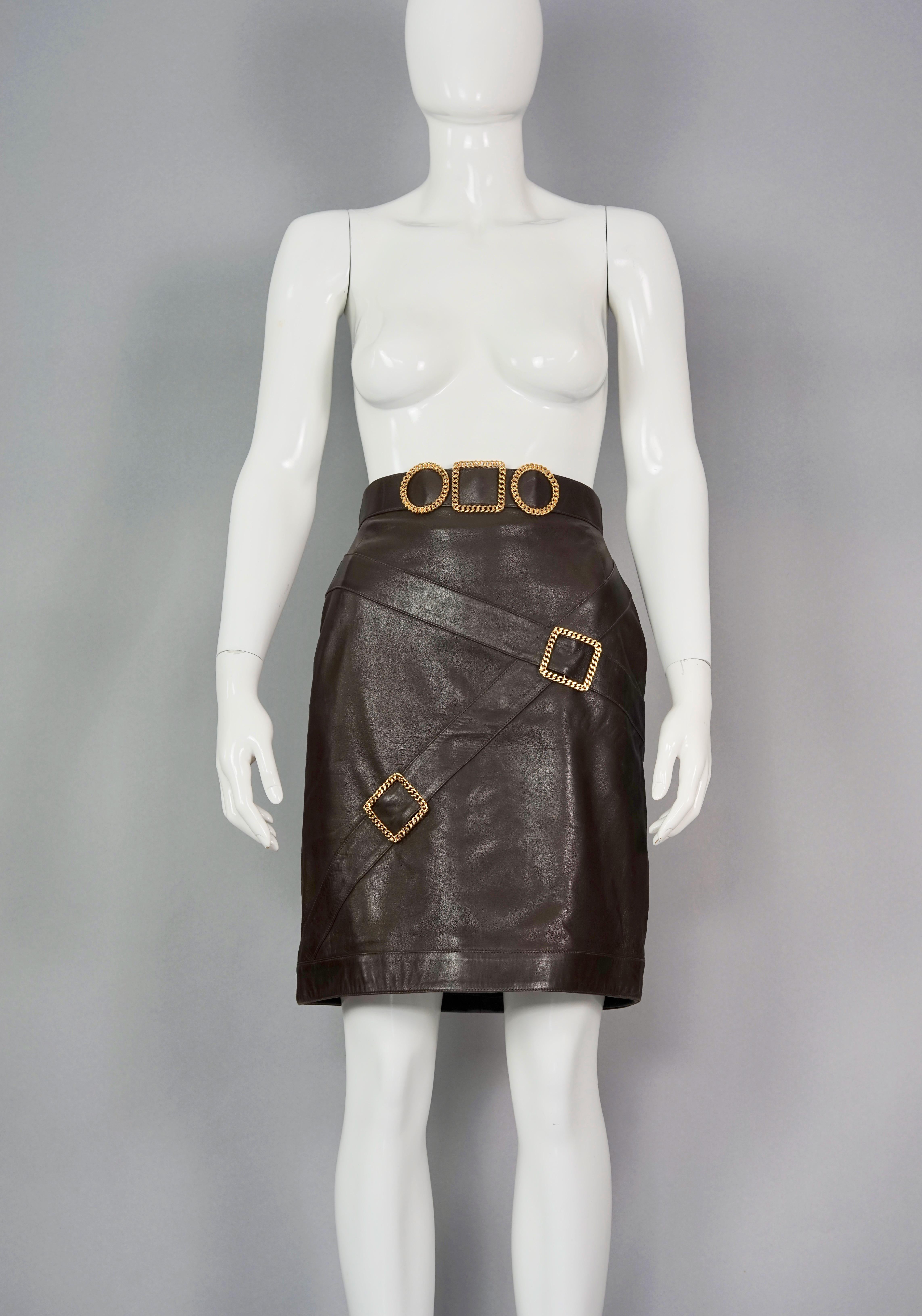 Vintage Iconic CHANEL Buckle Leather Skirt

Measurements taken laid flat, please double waist and hips:
Waist: 13.78 inches (35 cm)
Hips: 18.11 inches (46 cm)
Length: 20.47 inches (52 cm)

Features:
- 100% Authentic CHANEL.
- Brown lambskin pencil