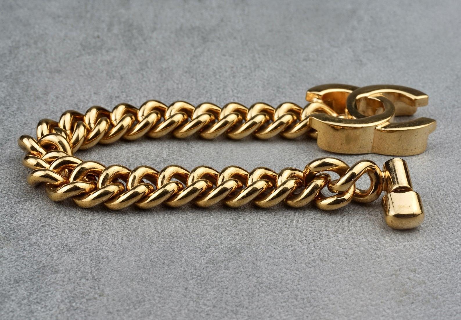 Vintage Iconic CHANEL CC Turnlock Chain Bracelet

Measurements:
Height: 0.98 inch (2.5 cm)
Wearable Length: 7.28 inches (18.5 cm)

Features:
- 100% Authentic CHANEL.
- Chain bracelet with CC turnlock.
- Turnlock CC closure.
- Signed CHANEL 95 CC A