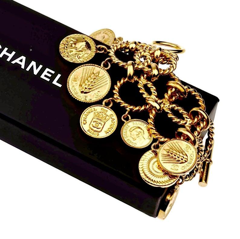 Vintage ICONIC CHANEL Logo Coin Medallion Charm Hoop Chain Bracelet

Measurements:
Height: 2.95 inches (7.5 cm)
Wearable Length: 7.87 inches (20 cm)

Features:
- 100% Authentic CHANEL.
- Chunky bracelet with 9 iconic Chanel logo emblem coin/