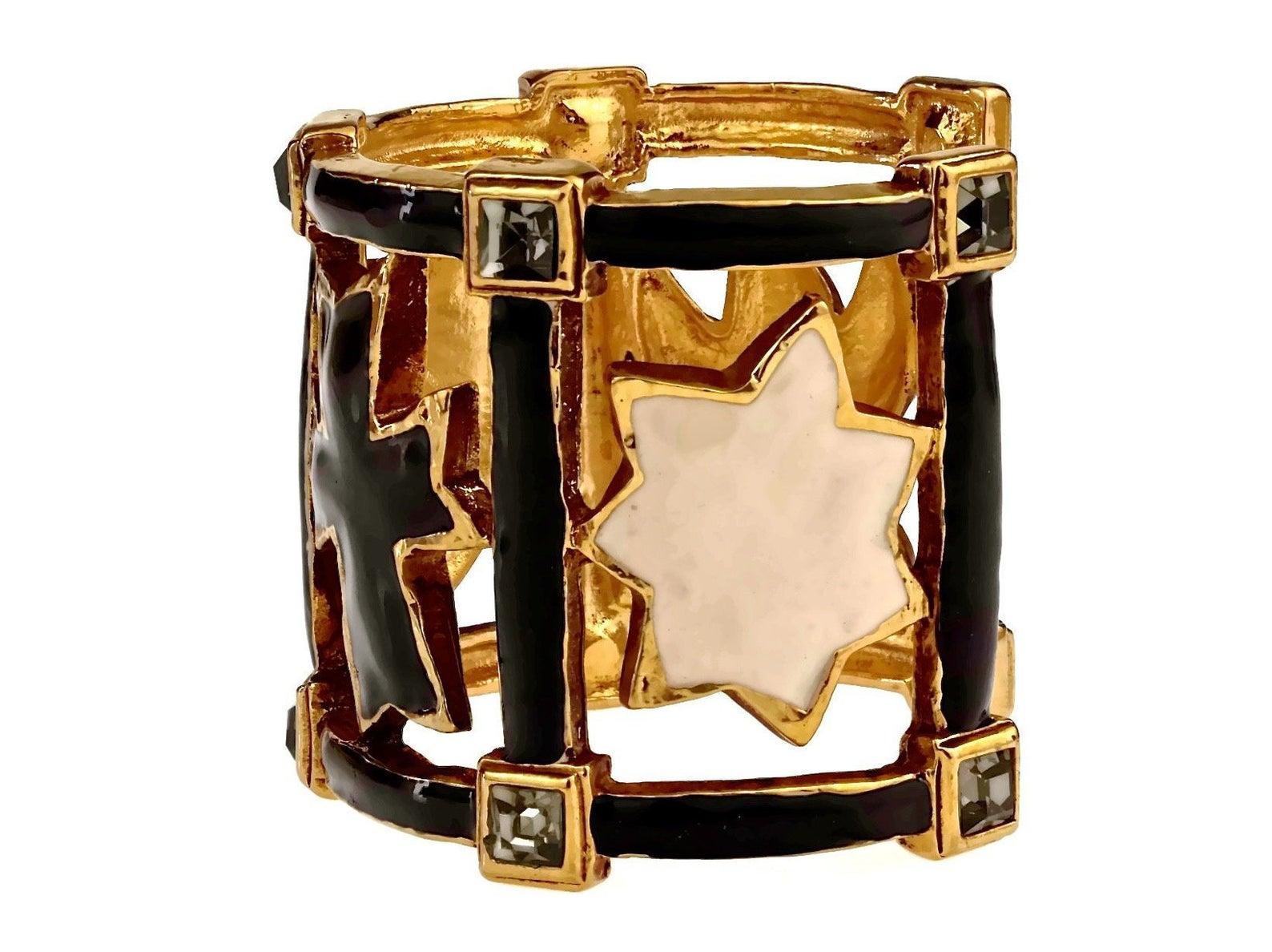 Vintage Iconic CHRISTIAN LACROIX Enamel Emblem Rhinestone Cuff Bracelet

Measurements:
Height: 2.28 inches (5.8 cm)
Inner Circumference: 6.57 inches (16.7 cm)

Features:
- 100% Authentic CHRISTIAN LACROIX.
- Black and white enamel cuff with iconic