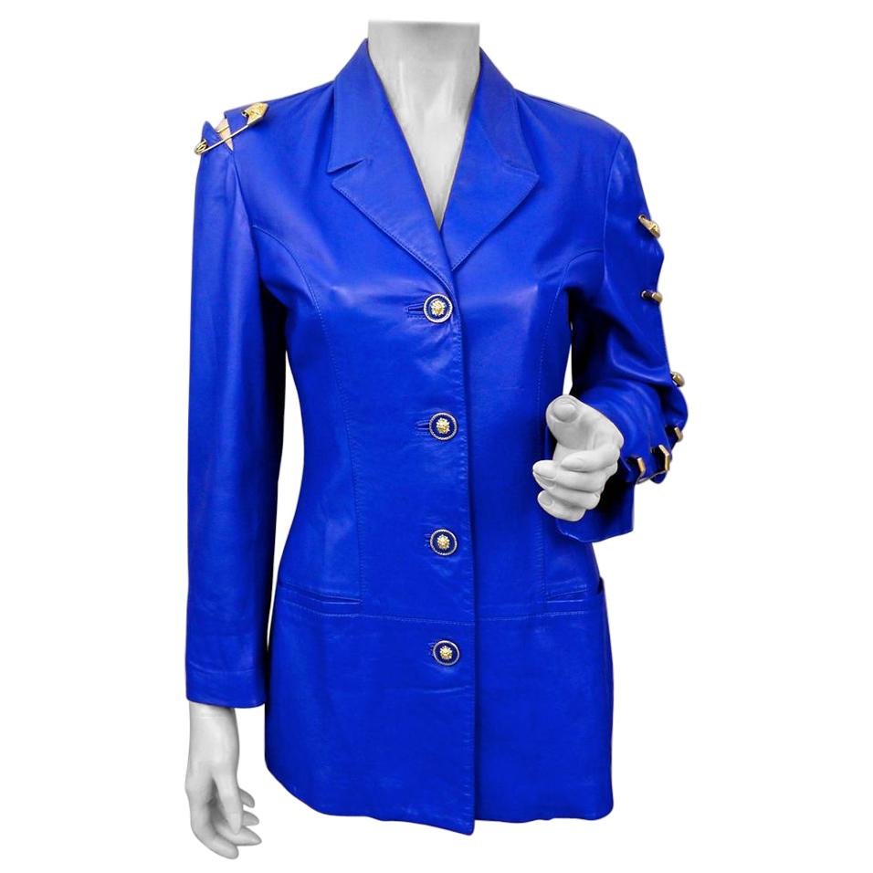 Vintage Iconic GIANNI VERSACE VERSUS Safety Pin Blue Leather Jacket

Measurements taken laid flat, please double bust and waist:
Shoulder: 16.14 inches (41 cm)
Sleeves: 22 inches (56 cm)
Bust: 17.71 inches (45 cm)
Waist: 15.15 inches (38.5