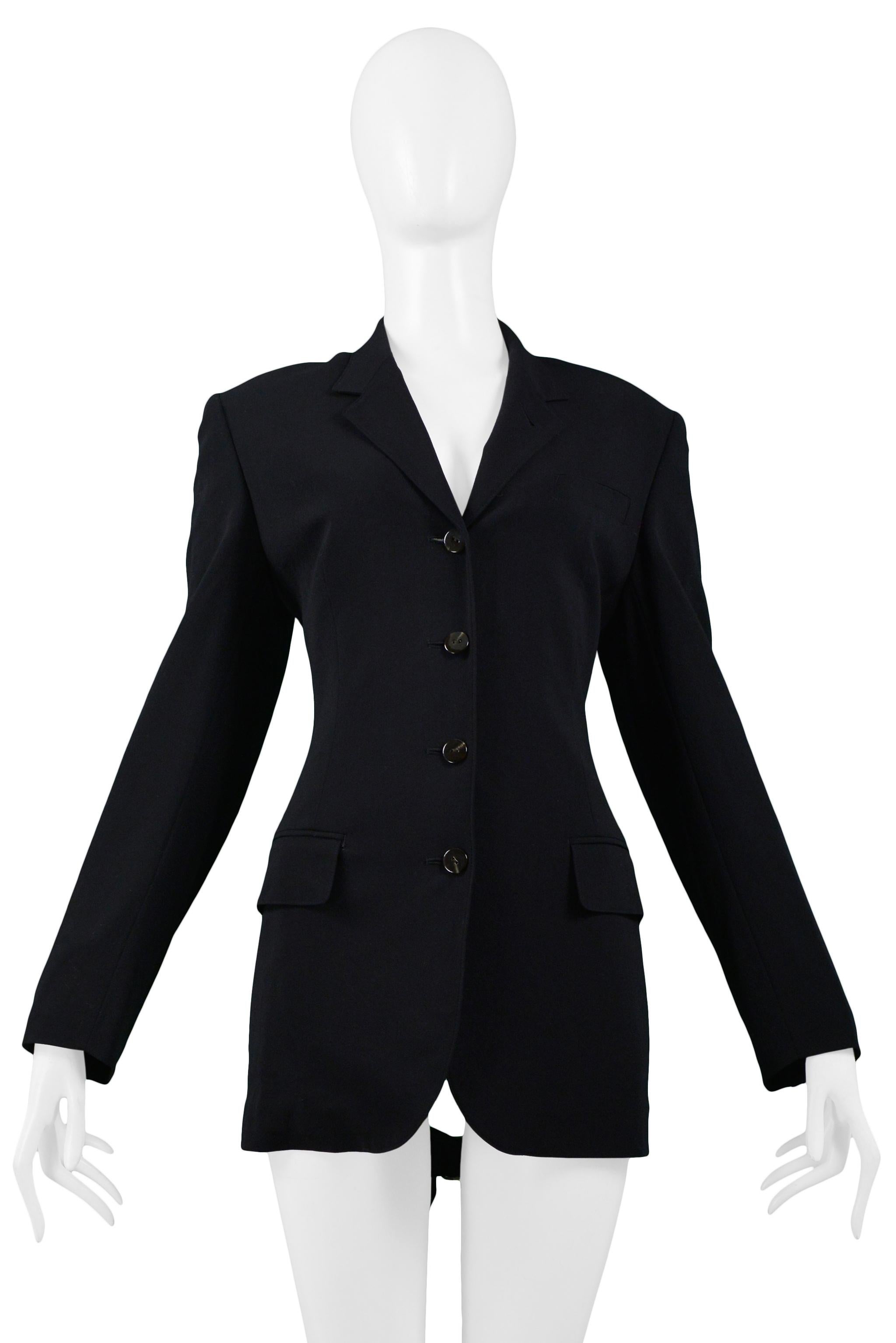 Resurrection Vintage is excited to offer a vintage Jean Paul Gaultier black blazer jacket with fitted three-button front, front side flap pockets, a cutout back panel featuring five buckle straps with silver hardware. Circa the 1990s. 

Jean Paul
