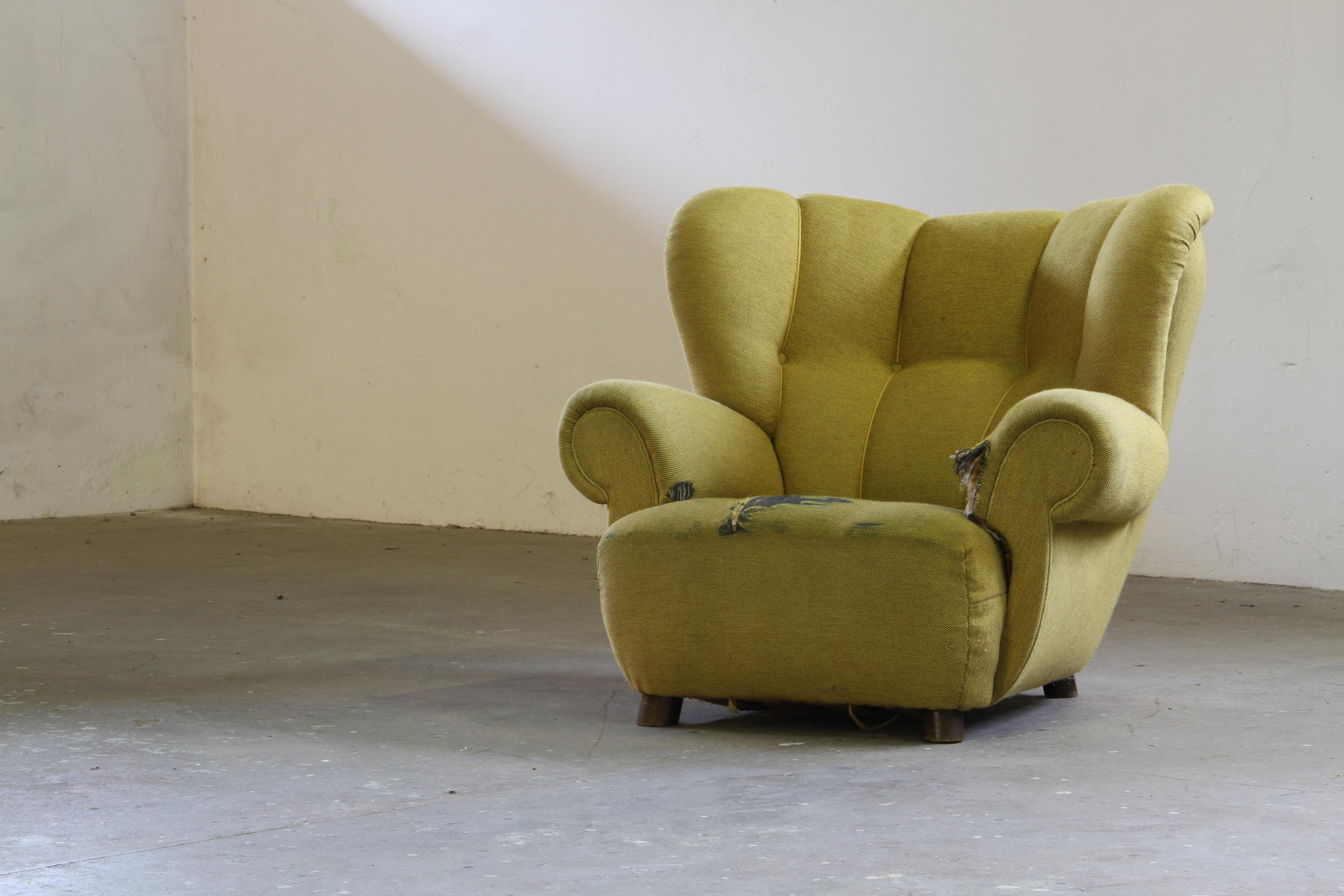 We present this iconic rare armchair, crafted in Denmark circa 1930s, likely by Fritz Hansen, evoking the spirit of Flemming Lassen’s 