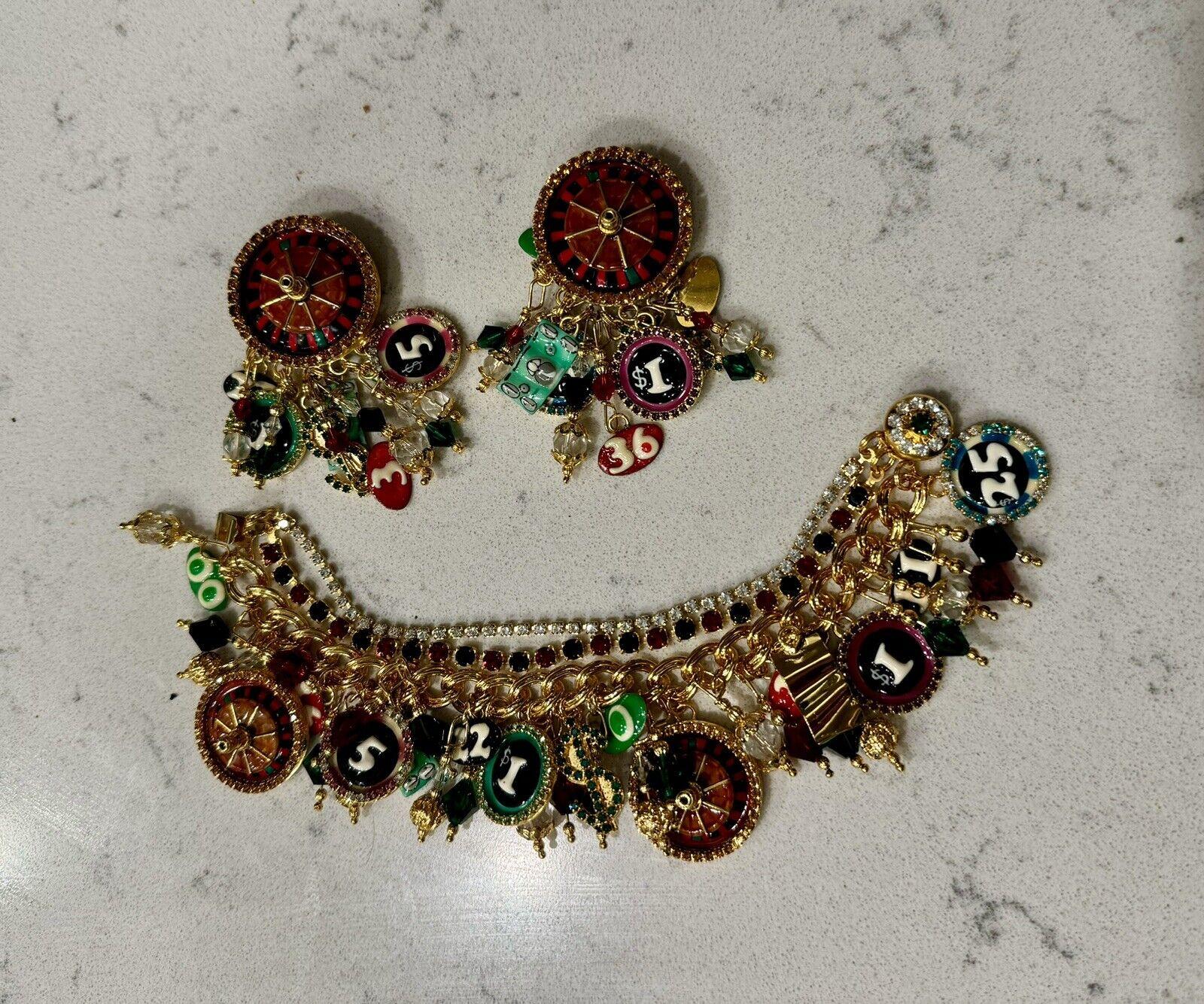 Simply Beautiful! Vintage Oscar Worthy Iconic Lunch at the Ritz Designer Signed Statement Roulette Multi Charm Bracelet and Drop Vegas Clip Earrings and matching Drop/Dangle Clip Earrings. Double row Sparkling Crystal Bracelet, suspending numerous