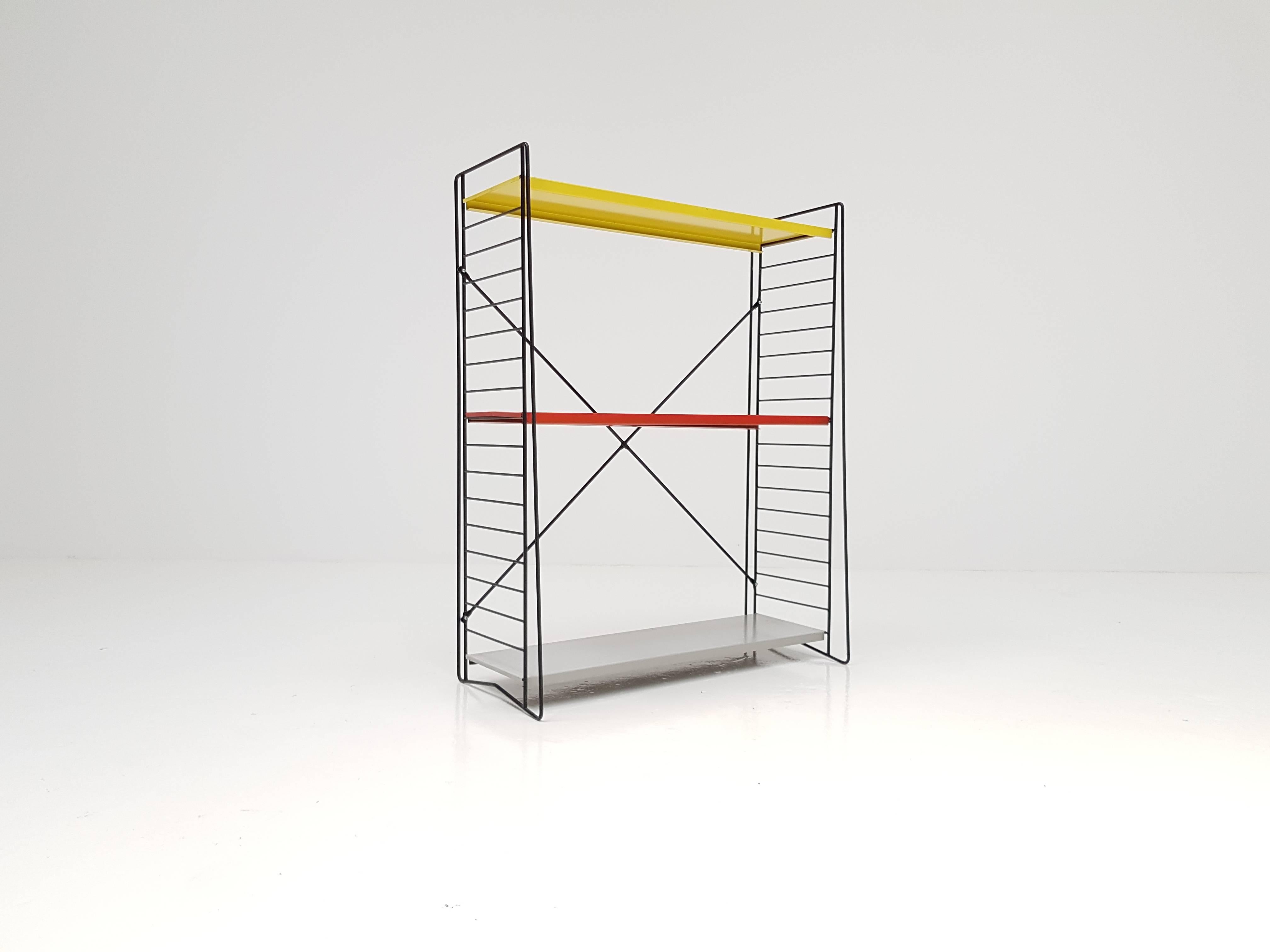 Classic and iconic vintage Dutch Tomado freestanding shelves/book racks, designed mid-1950s by A. Dekker.

Powder coated frame and adjustable steel shelves. This design looks amazing in any room and location and the freestanding pieces are rare