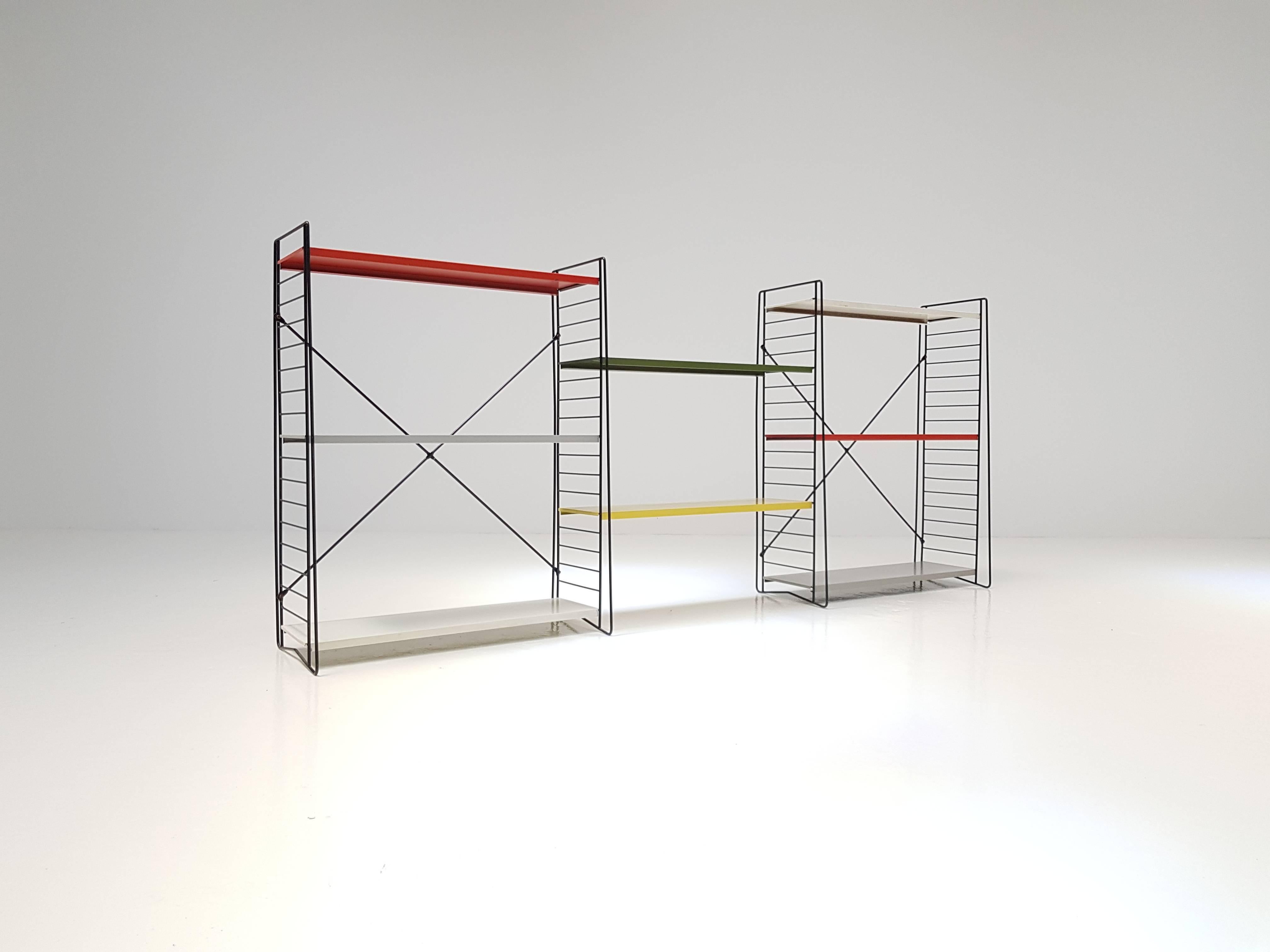 Classic and iconic vintage Dutch Tomado freestanding shelves/book racks, designed mid-1950s by A. Dekker.

Powder coated frame and adjustable steel shelves. This design looks amazing in any room and location and the freestanding pieces are rare