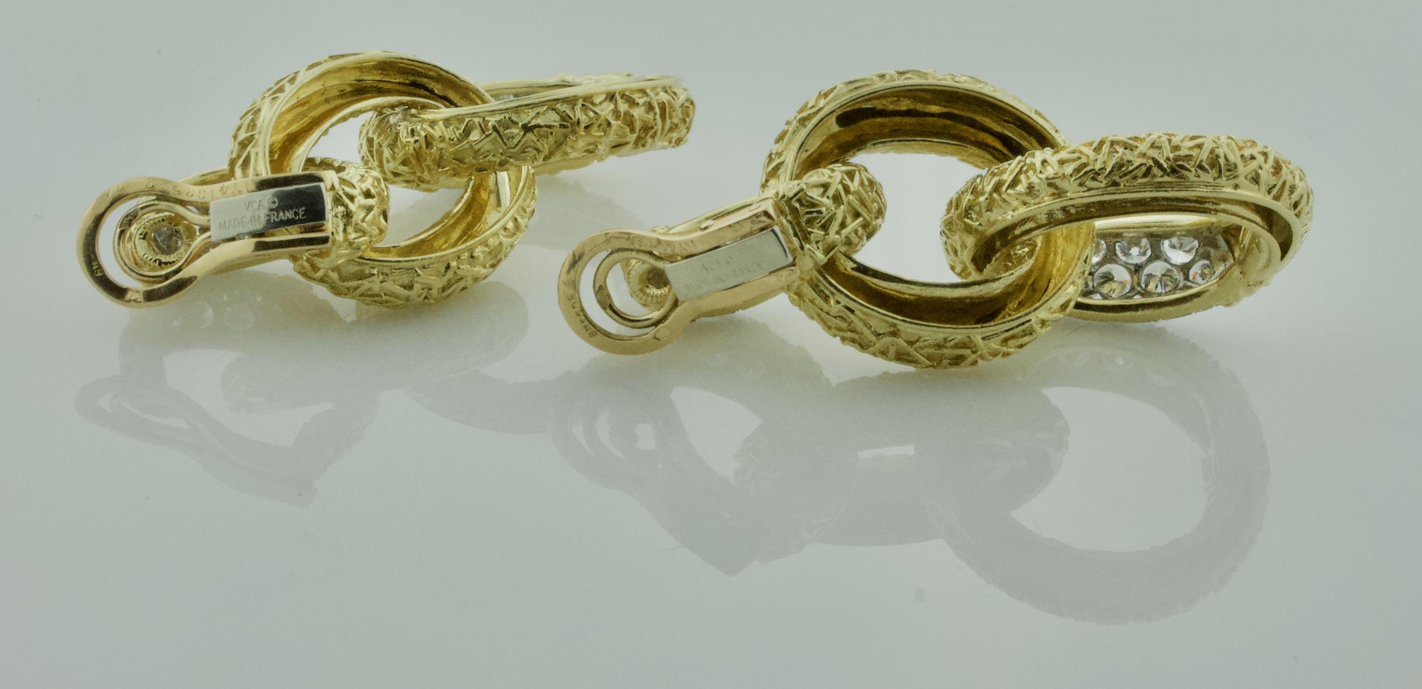 These exquisite vintage Van Cleef & Arpels earrings, crafted circa the 1960s, are a stunning example of timeless elegance and expert craftsmanship. Made in a luxurious combination of 18k yellow gold and platinum, the design features three