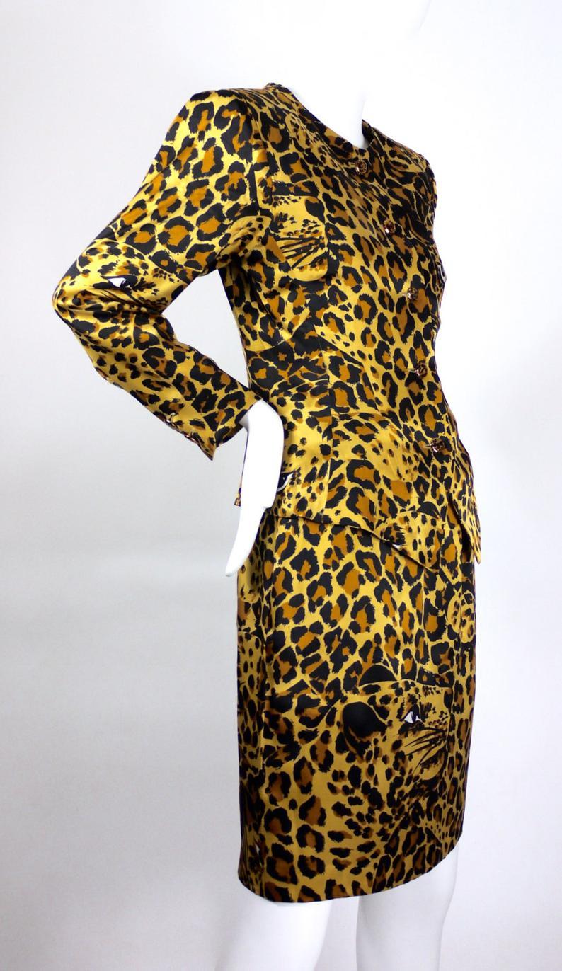 Vintage Iconic YVES SAINT LAURENT Rive Gauche Silk Leopard Print Suit

Measurements taken laid flat:
BLAZER/ BLOUSE
Shoulder: 16 inches
Sleeves: 22 inches
Bust: 36 inches
Waist: 30 inches
Length: 25 inches (down to the pointed edges)

SKIRT
Waist: