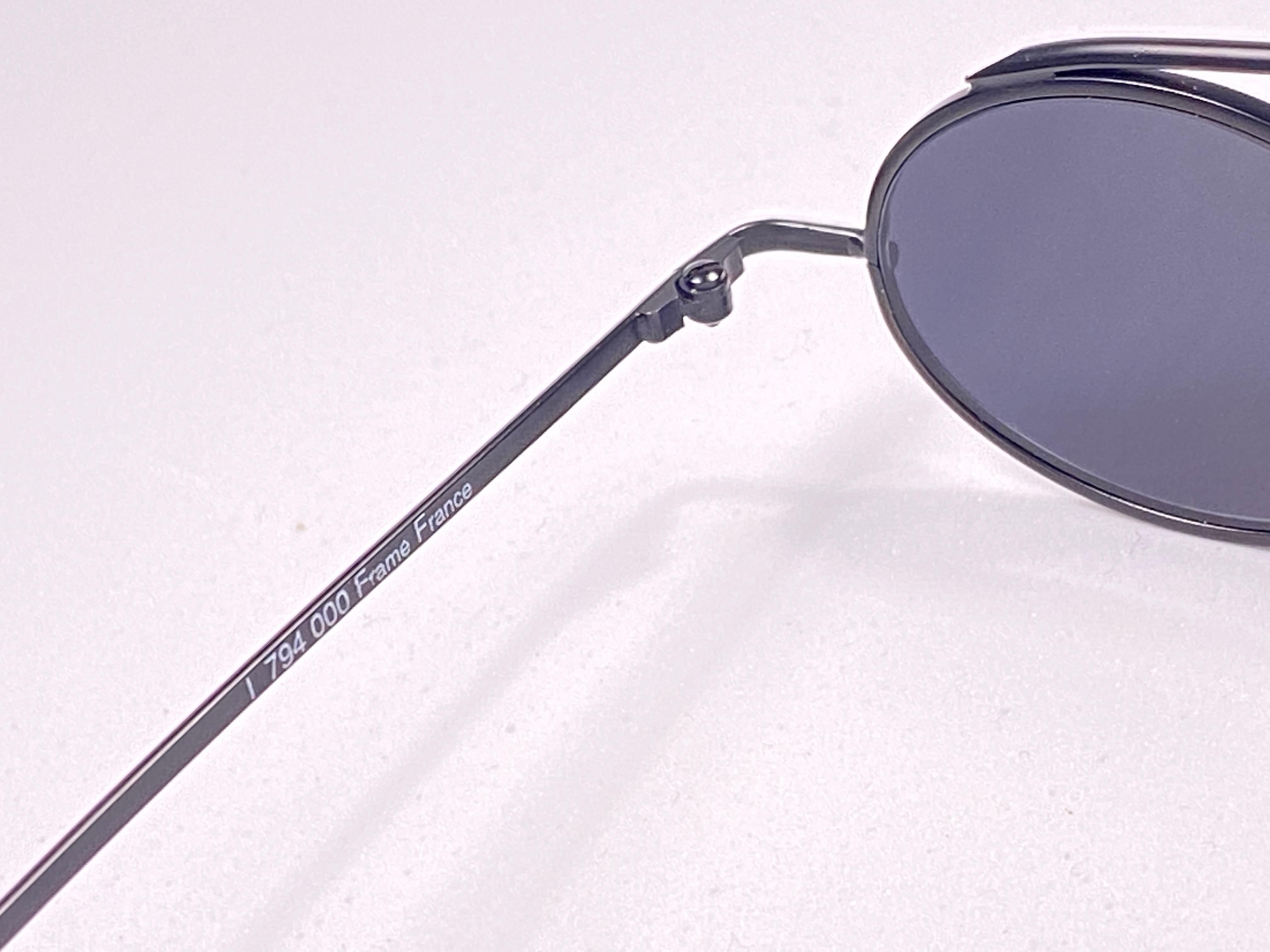 

IDC black matte frame with dark grey lenses.

This pair could show minor sign of wear due to storage. 
Made in France.

MEASUREMENTS : 



FRONT : 12.5 CMS

LENS HEIGHT : 2.8 CMS 

LENS WIDTH : 4 CMS 

