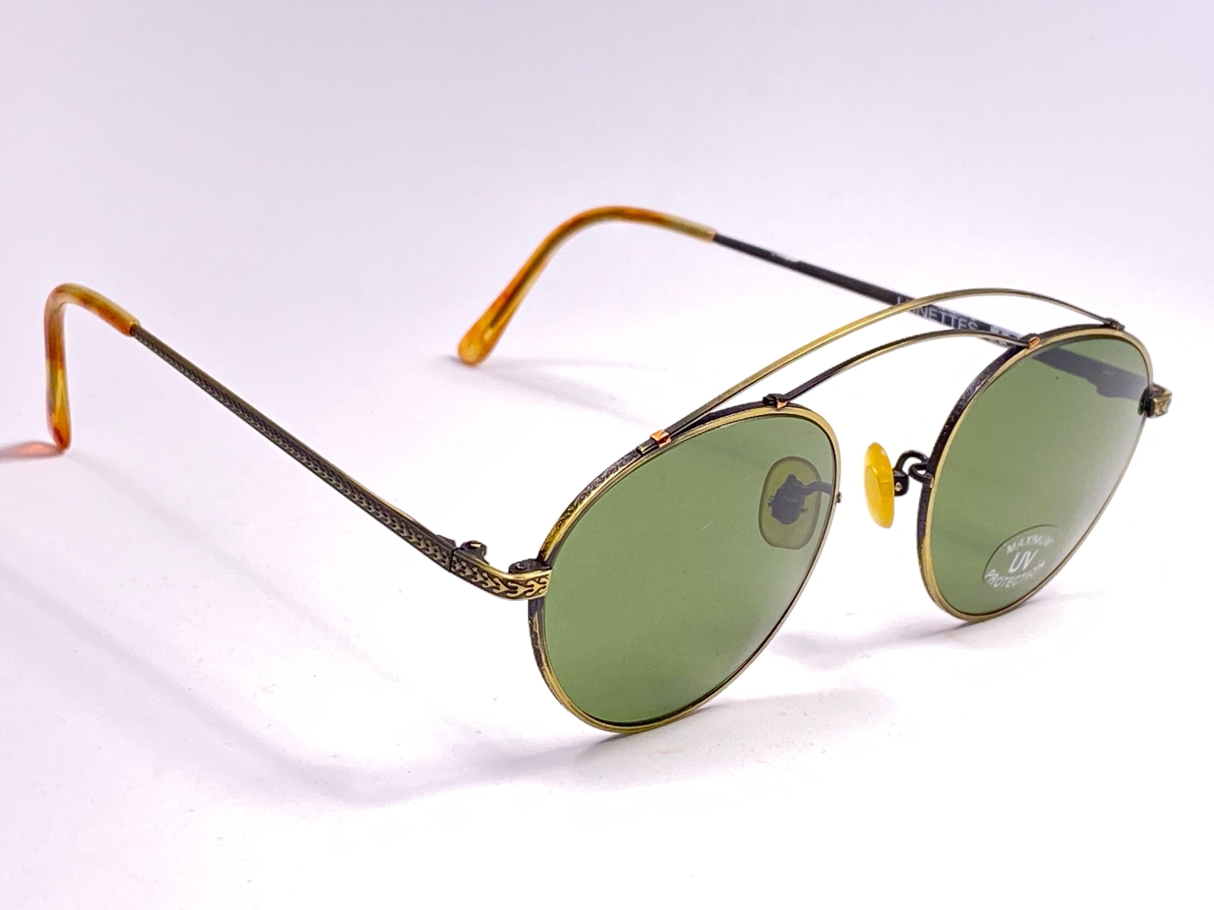 

IDC copper round, green. lenses.

This pair could show minor sign of wear due to storage. 
Made in France.