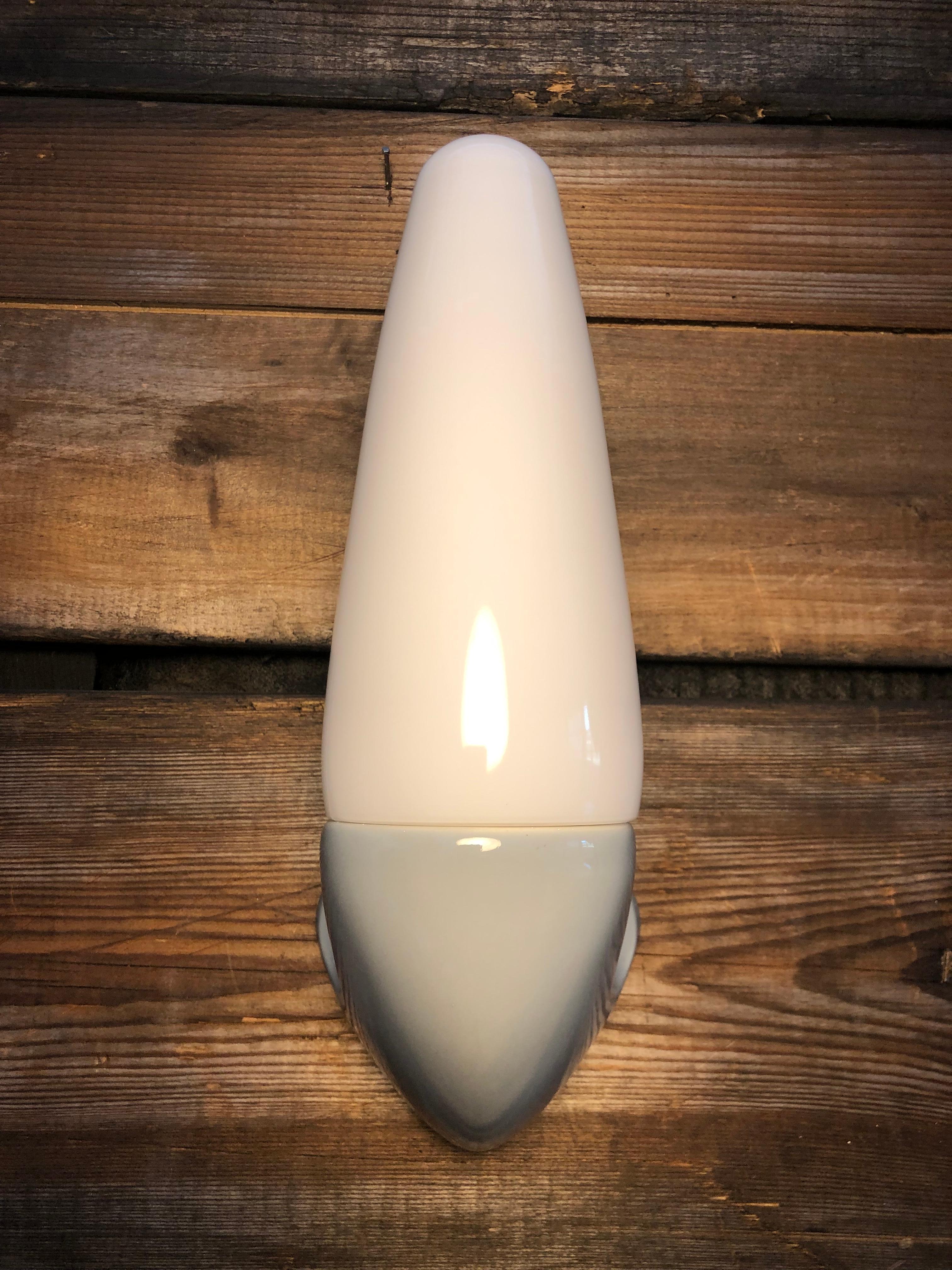 Vintage Ifö of Sweden ceramic bathroom lamps from the 1960s in grey. 
Designed by Sigvard Bernadotte. 
Opaline glass shades. 
Ceramic bulb holders for an E14 bulb
Lamps can be used as up or down lights.
In great condition and ready to use.
Will be