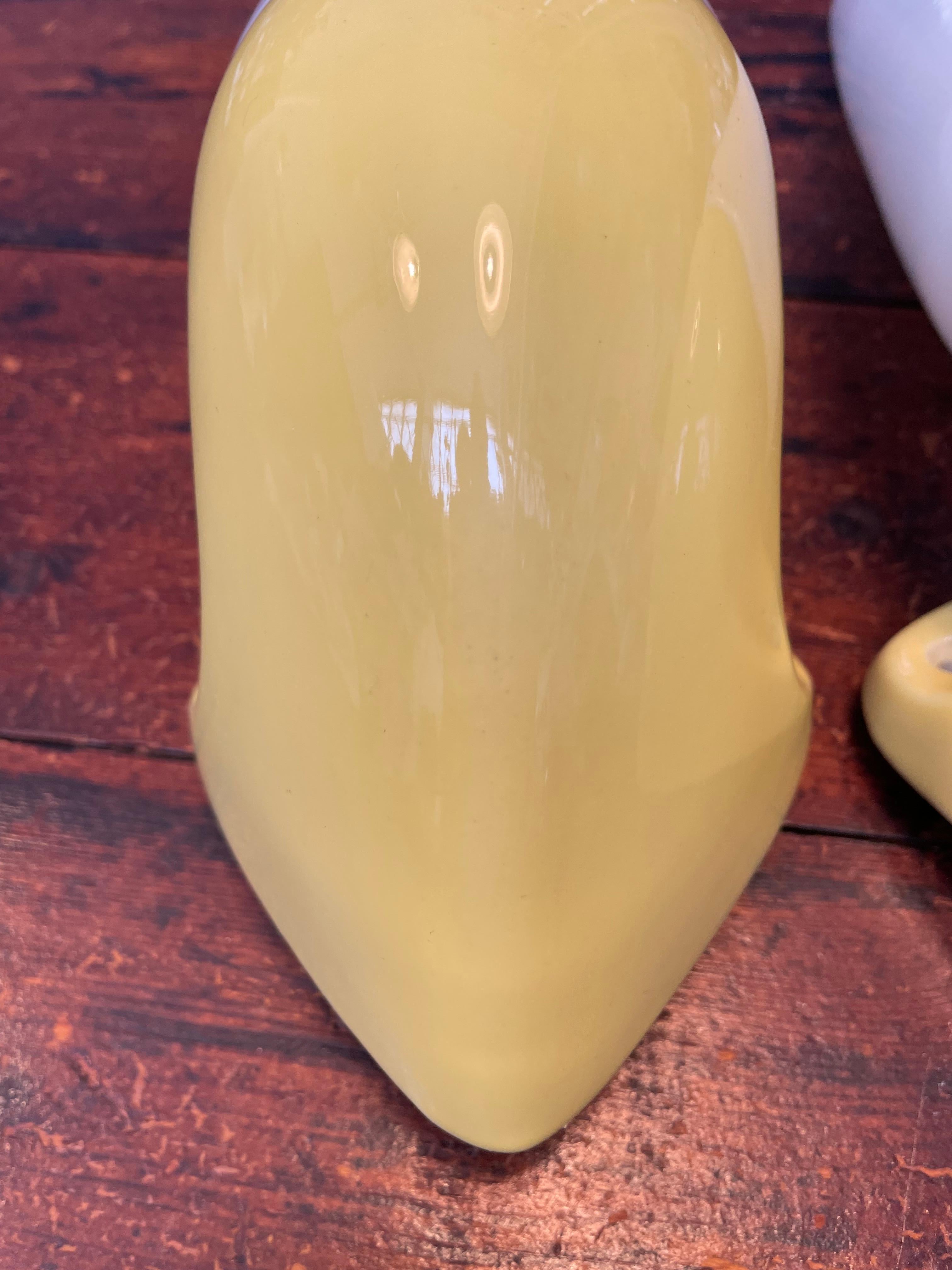 Vintage Ifö of Sweden ceramic bathroom lamps from the 1960s in yellow and with the original boxes.
Model 6035. 
Designed by Sigvard Bernadotte. 
Opaline glass shades. 
Ceramic bulb holders for an E14 bulb
Lamps can be used as up or down lights.
In
