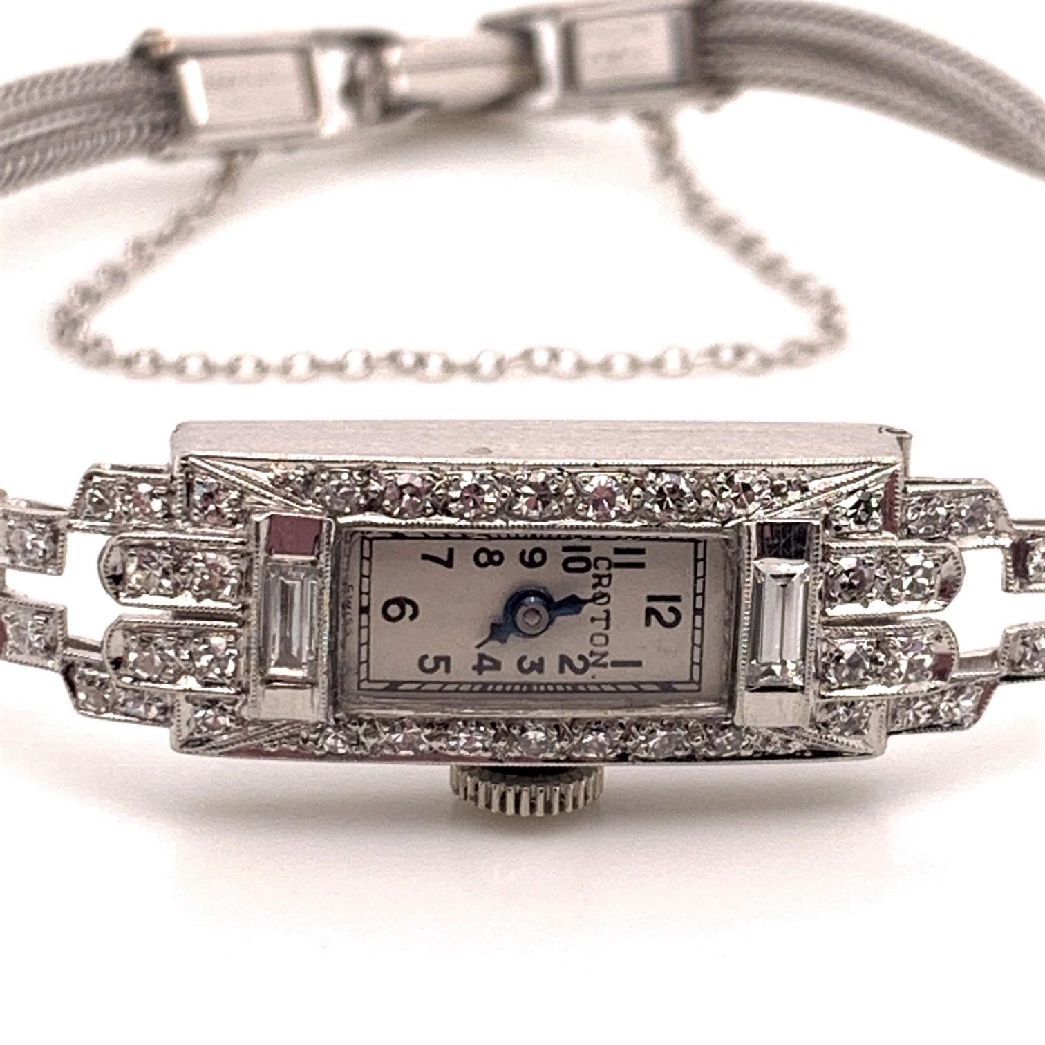 This beautiful vintage timepiece is a showstopper with it's 0.86 carats of diamonds, both baguette and round shaped, set in stunning platinum case with a 14 karat White Gold bracelet and clasp. It is a rare find with its Art Deco step styled design