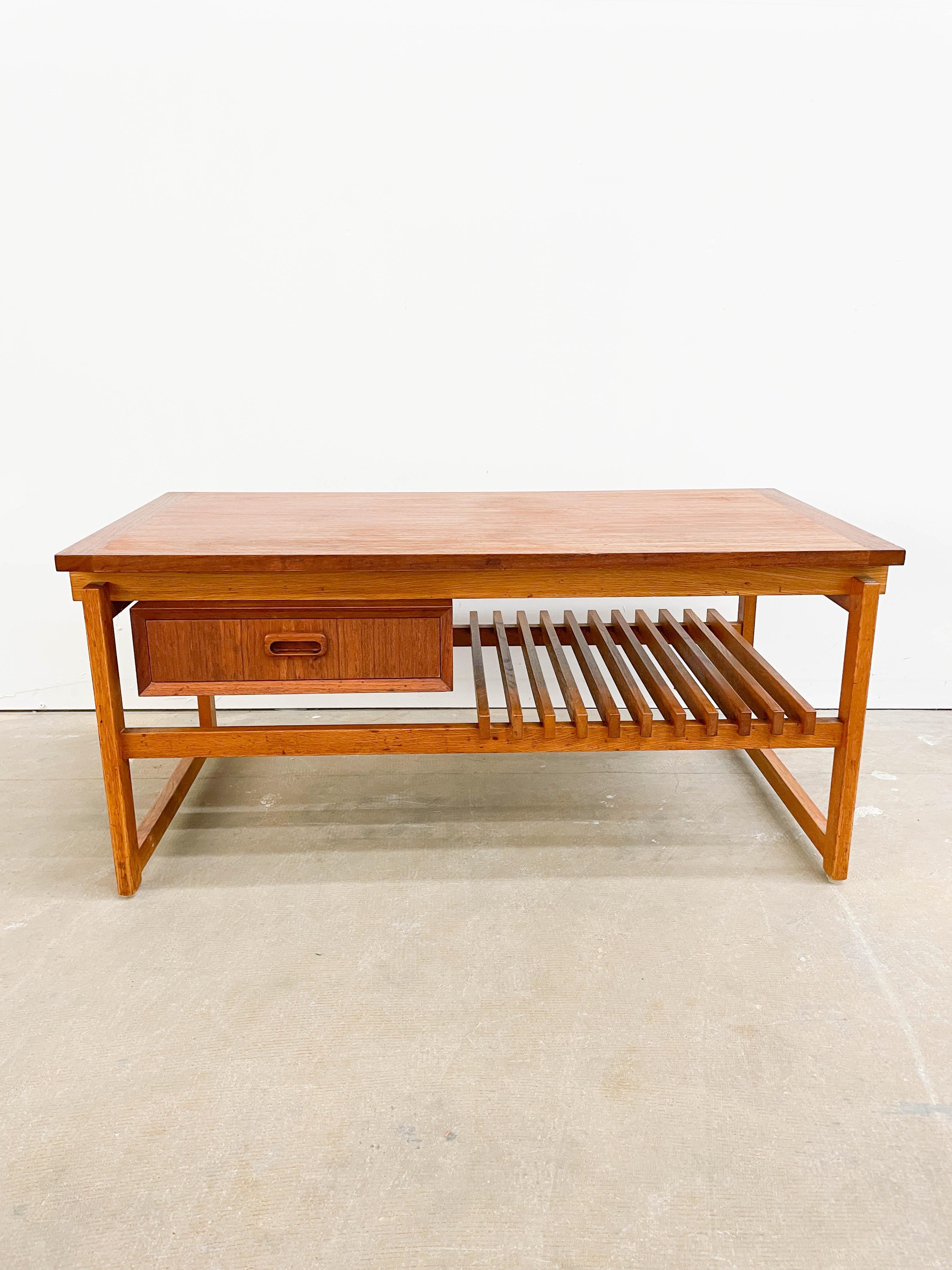 Vintage IKEA contructivist Danish Modern table / bench designed by Maahr and Nielsen in 1961 from their Petita range. This table incorporates a magazine rack and drawer made from teak. This piece combines some very nice architectural