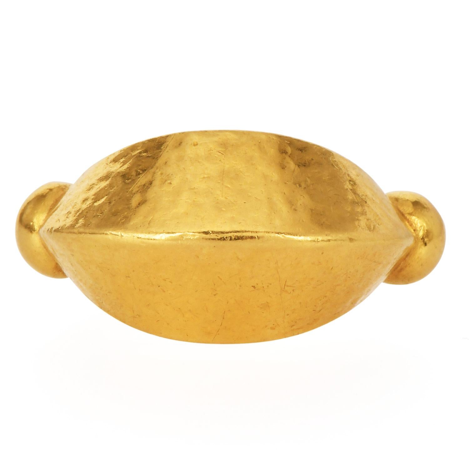 Vintage Ilias Lalaounis 22K Yellow Gold Hammered Dome Ring

This exquisite vintage Ilias Lalaounis ring is crafted in fine 22K yellow gold and features a unique hammered texture with a tapered dome-like structure.

Known for his Greek jewelry, Ilias