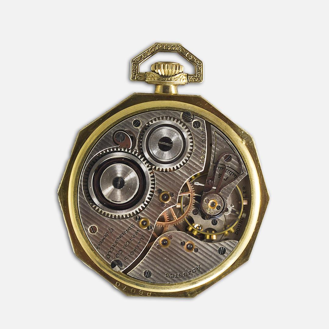 Montre de poche en or de l'Illinois.
Face ouverte, taille 12, modèle 117, mécanisme à double galet, 3/4 de la plaque.
Heure de la couronne réglée. Numéro de série 4067885, fabriqué en 1923.
Boîtier octogonal fantaisie et cadran gravé fantaisie.
Il