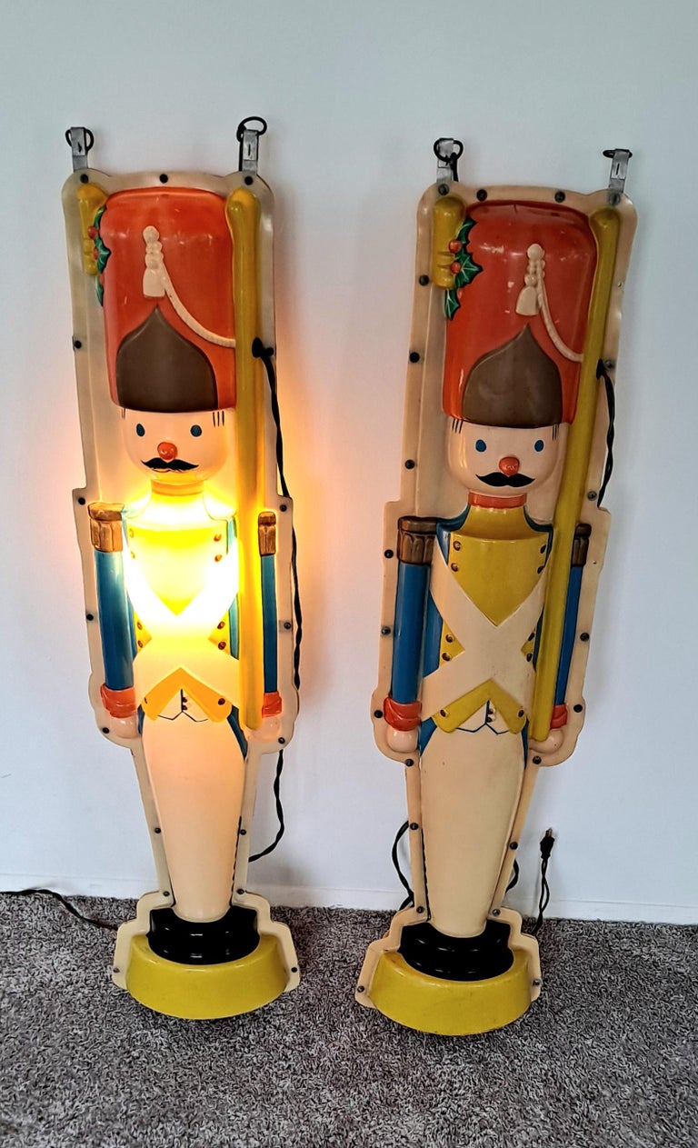 Large signs plastic nut crackers.

Set of two nut crackers, industrial plastic and illuminated sign from the Bullock department store in L.A.
 