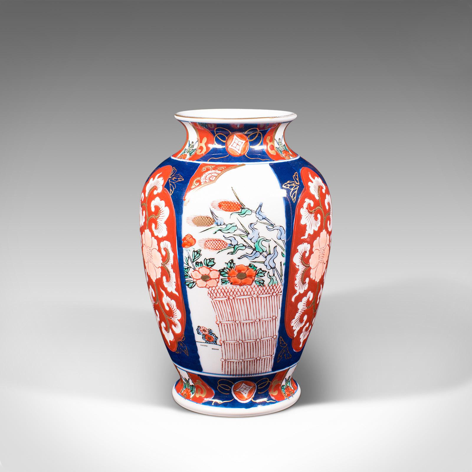 This is a vintage Imari vase. A Japanese, ceramic baluster urn, dating to the late Art Deco period, circa 1940.

Appealing vase in the distinguished Imari taste
Displaying a desirable aged patina and in good order
Full, consistent colour and