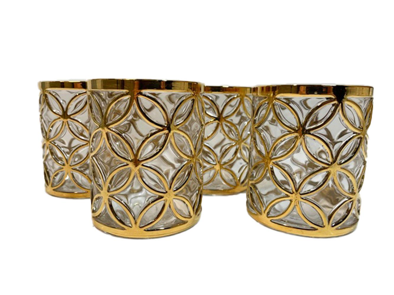 Mid-Century Modern rocks glasses made by Imperial Glass Company in the Sortijas de Oro pattern with a pattern of raised interlocked rings plated in 22 karat gold.