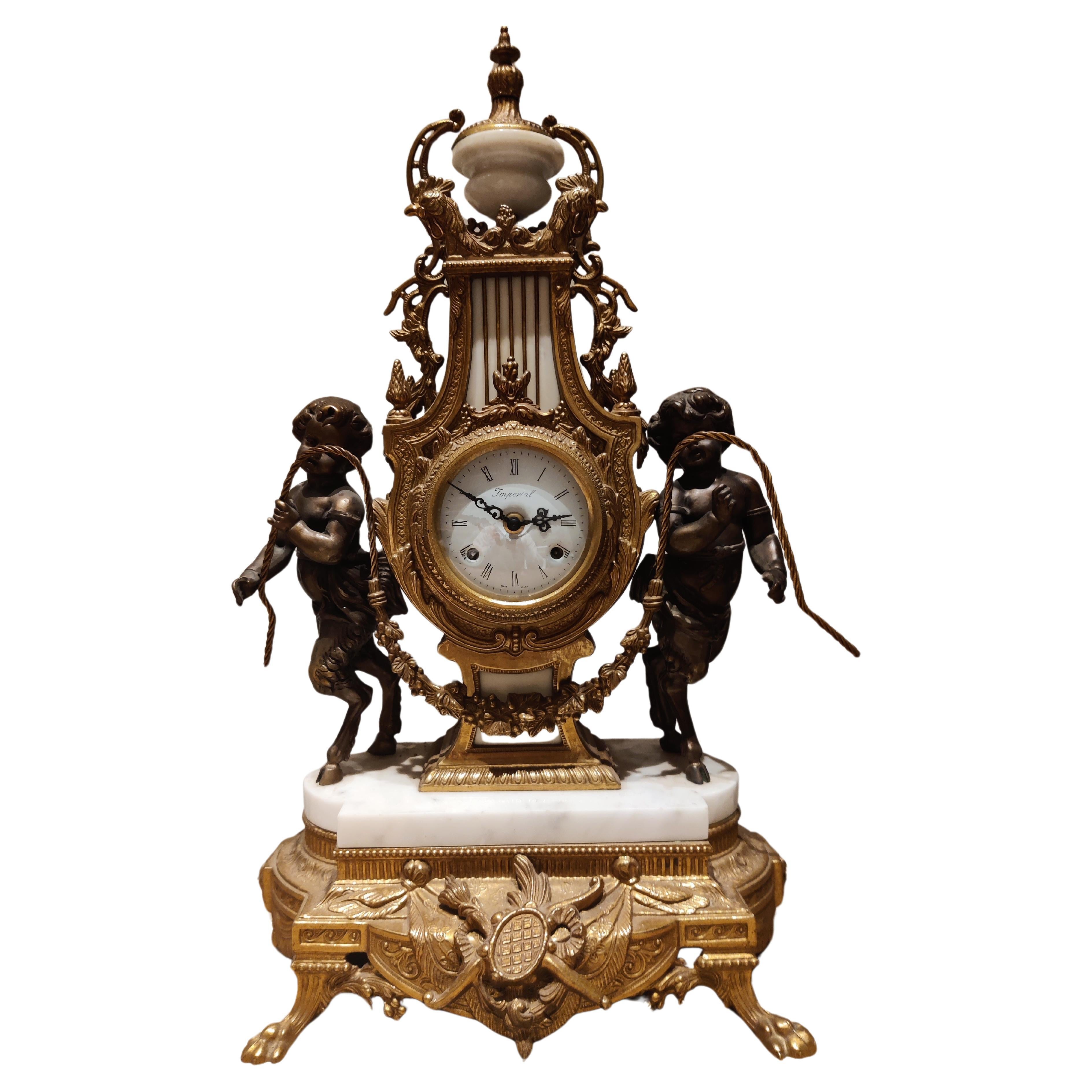 Vintage Imperial Mantle or Table Clock decorated with two angels For Sale