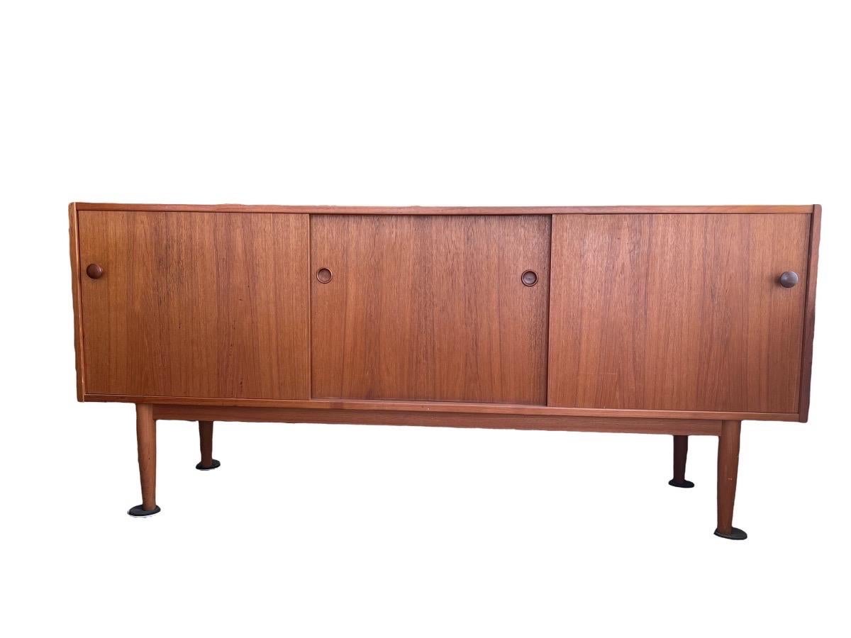 Vintage imported Danish Mid-Century Modern credenza or record cabinet.

Dimensions. 71 W ; 32 H ; 17 D.