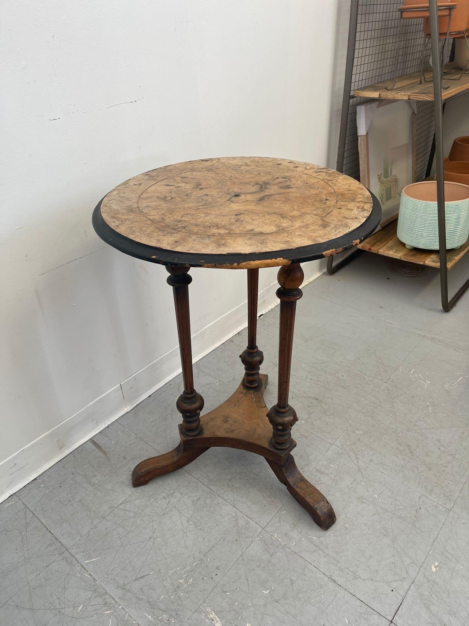 This circular Side Table features three turned wood legs with beautiful detailing below a stunning Burl wood top. Imported from the UK. Vintage Condition Consistent with Age as Pictured.

Dimensions. 20 Diameter; 27 H