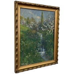 Cuadro impresionista vintage de un paisaje primaveral con un arroyo, en un marco con tonos dorados.