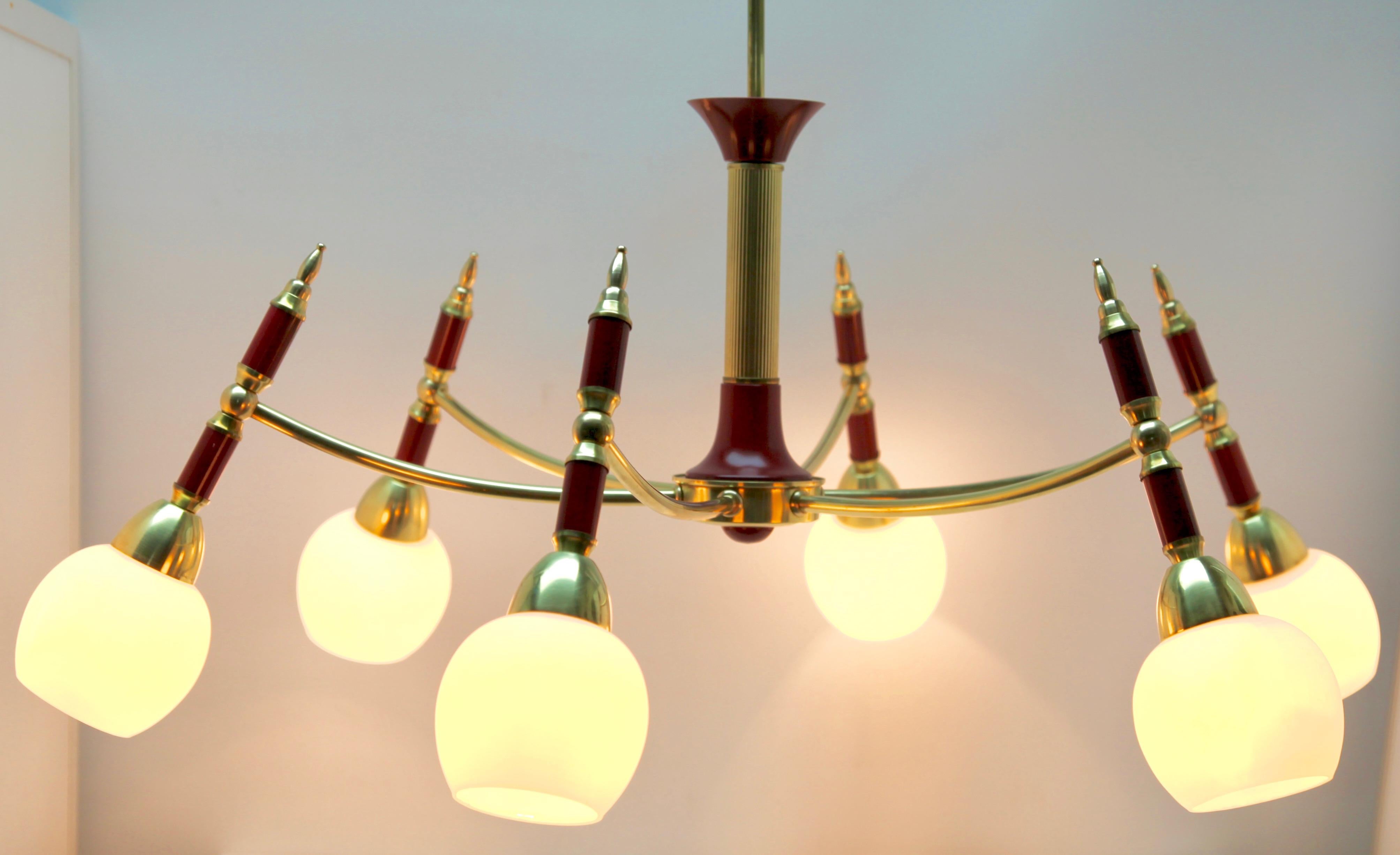 Eight arms chandelier style of Stilnovo.
Photography fails to capture the simple elegant illumination provided by this lamp.

Recently cleaned and polished so that it in excellent condition and in full working order having also
been re-wired