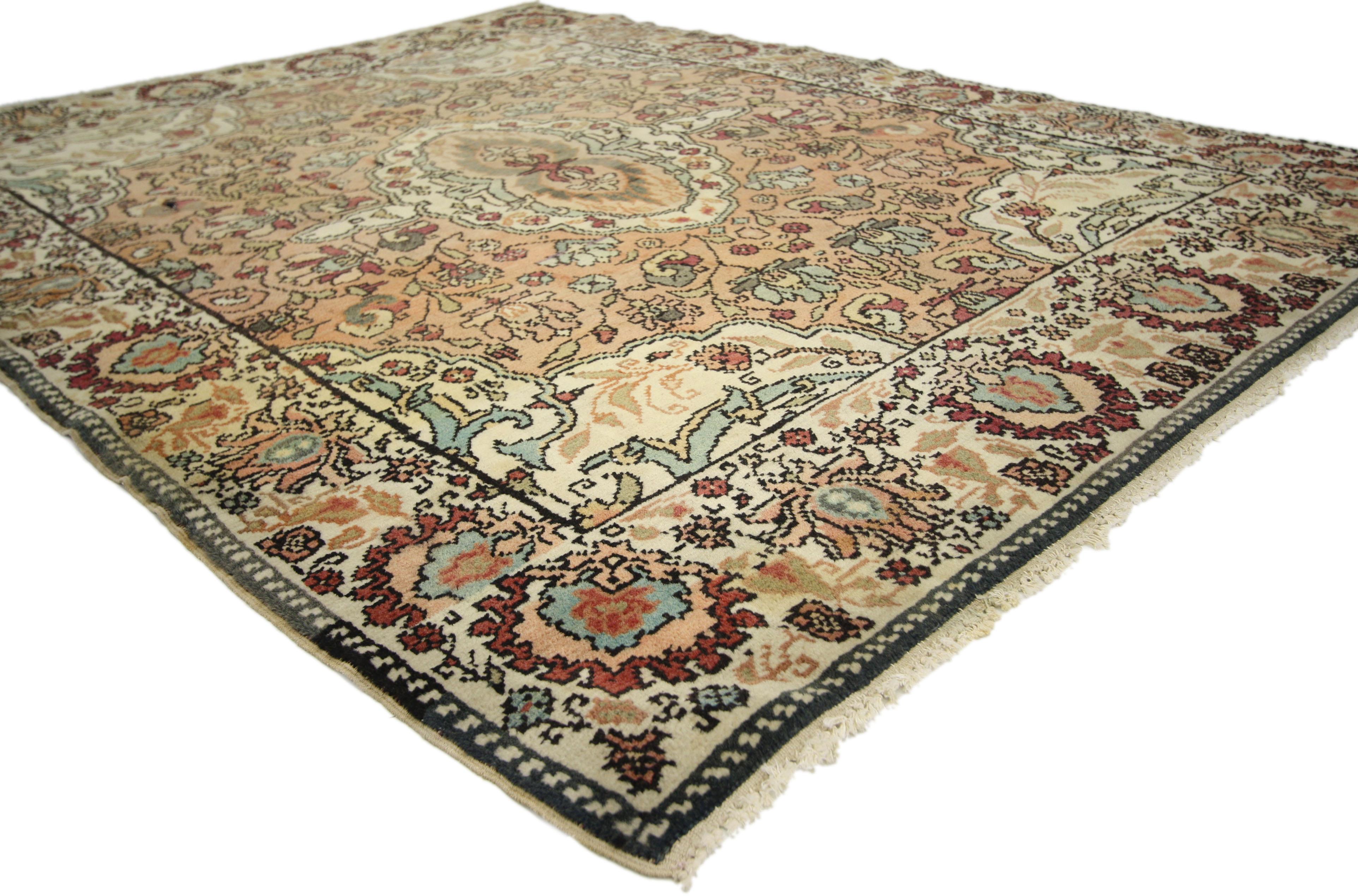 74659 vintage Indian Agra rug, Foyer or Entry rug. This hand knotted wool vintage Indian Agra accent rug features a cusped oval central medallion surrounded by an all-over floral pattern composed of blooming palmettes, leafy tendrils, organic