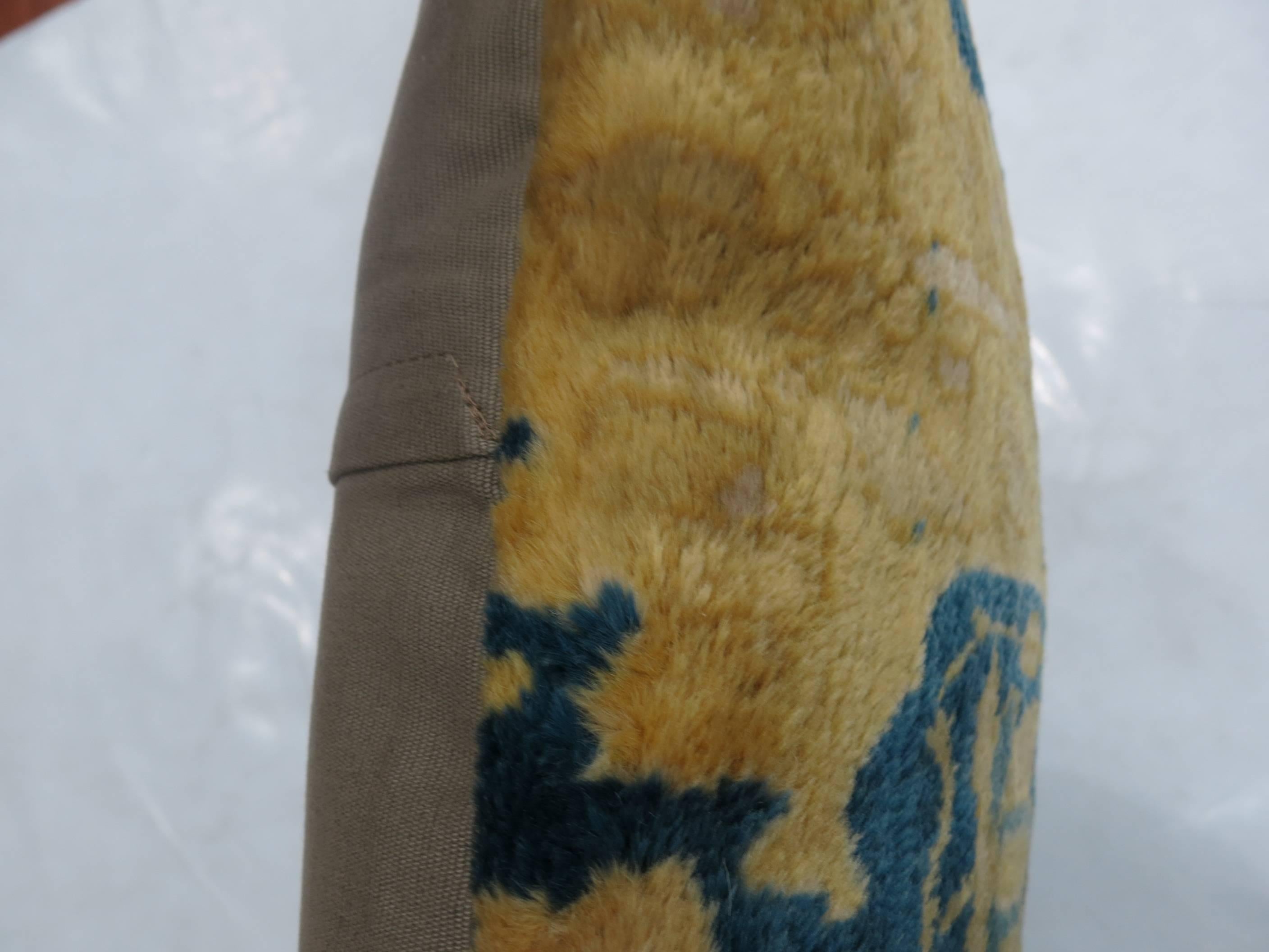 Pillow made from a vintage Indian Agra rug featuring fluffy wool in blue and gold. 

Measures 20'' x 20'' square.