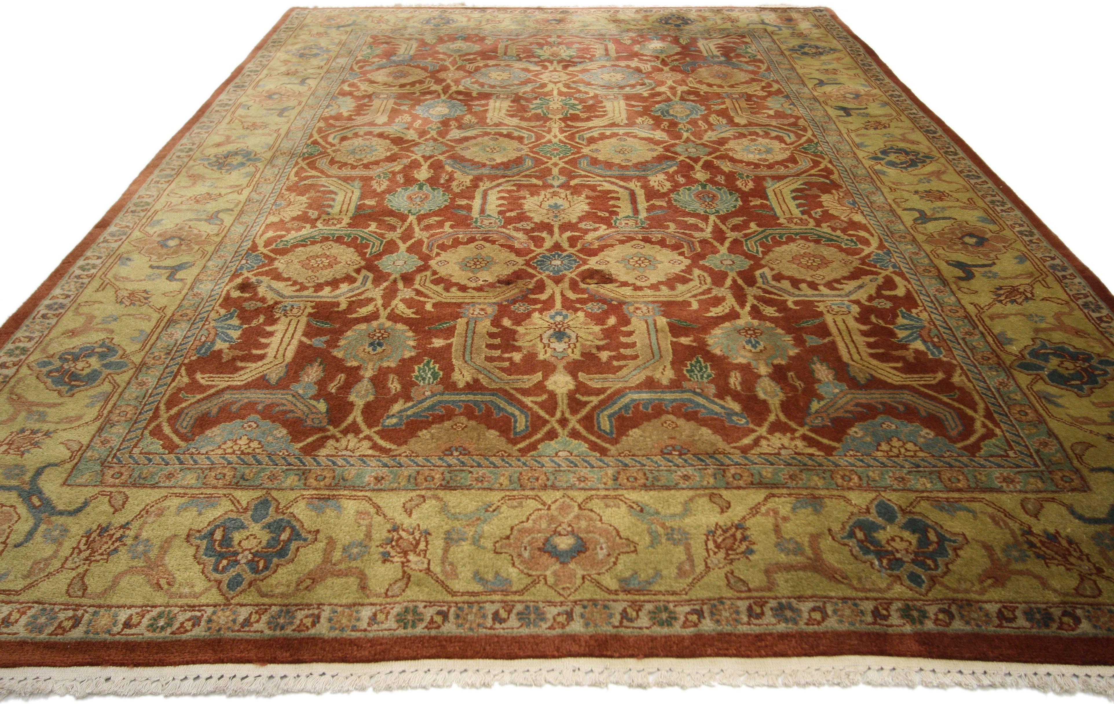 74382, vintage Indian area rug with traditional Persian style. This hand-knotted wool vintage Indian area rug with traditional Persian style features a bold all-over floral lattice pattern of repeating round blossoms surrounded by serrated leaves