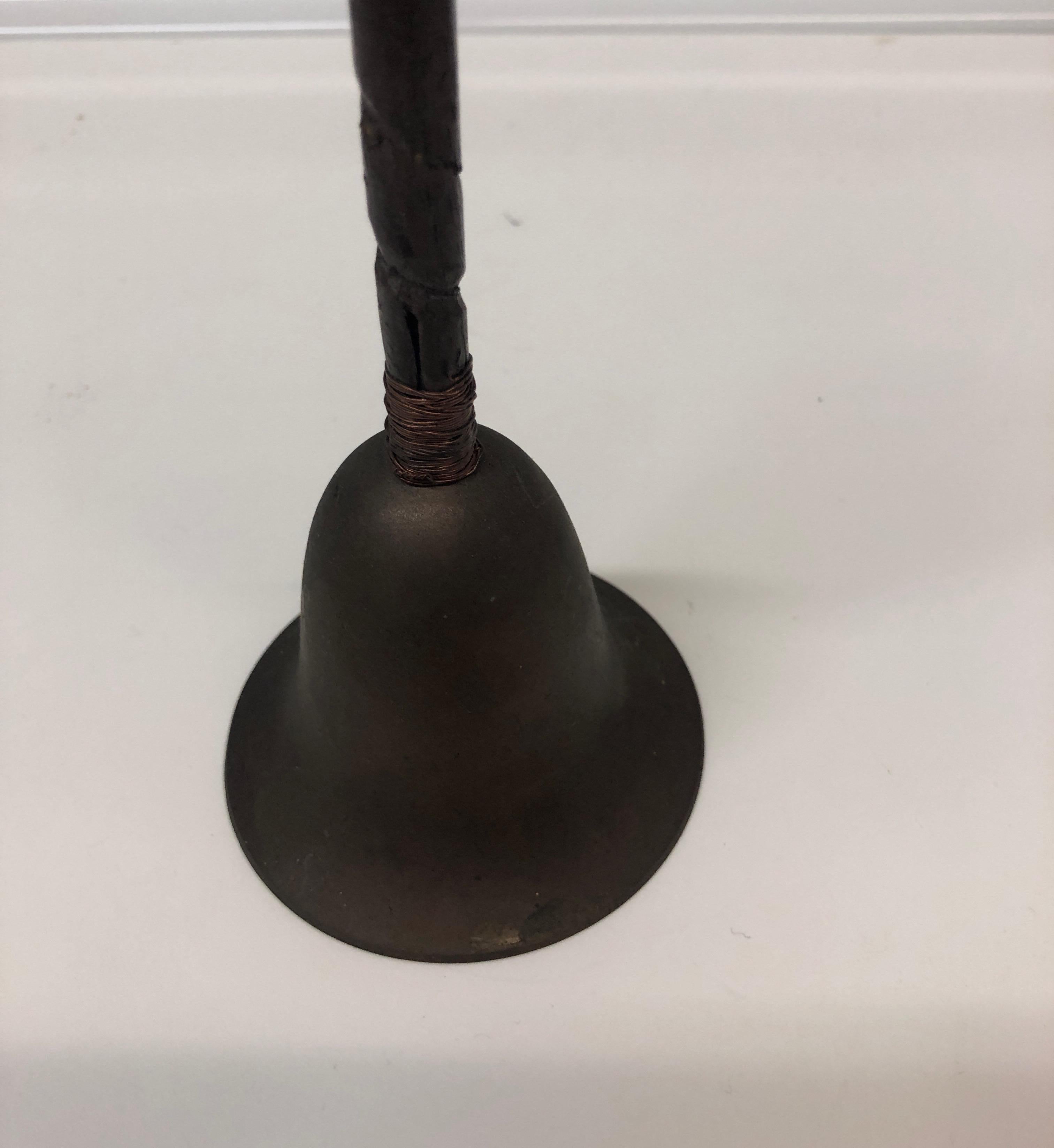 Vintage Indian brass and wood bell.
Size: 3” D x9” H.