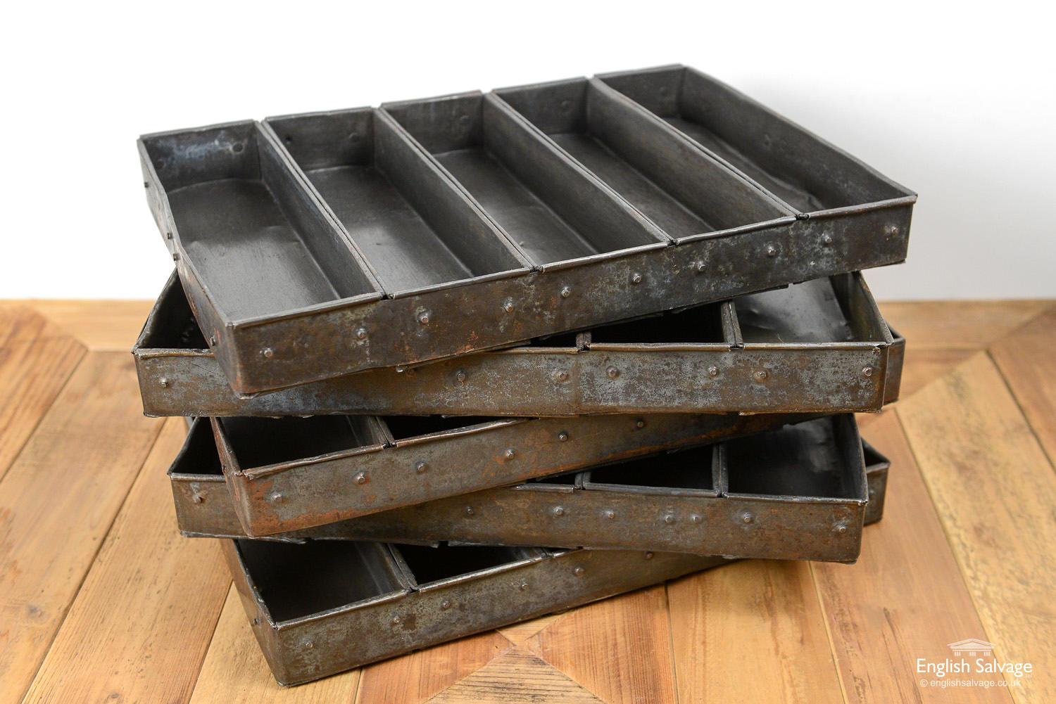 Vintage Indian bread baking trays or tins. Each has 5 sections for baking several loaves at the same time. Knocks and scratches commensurate with age and use. These could be repurposed for rustic style storage.