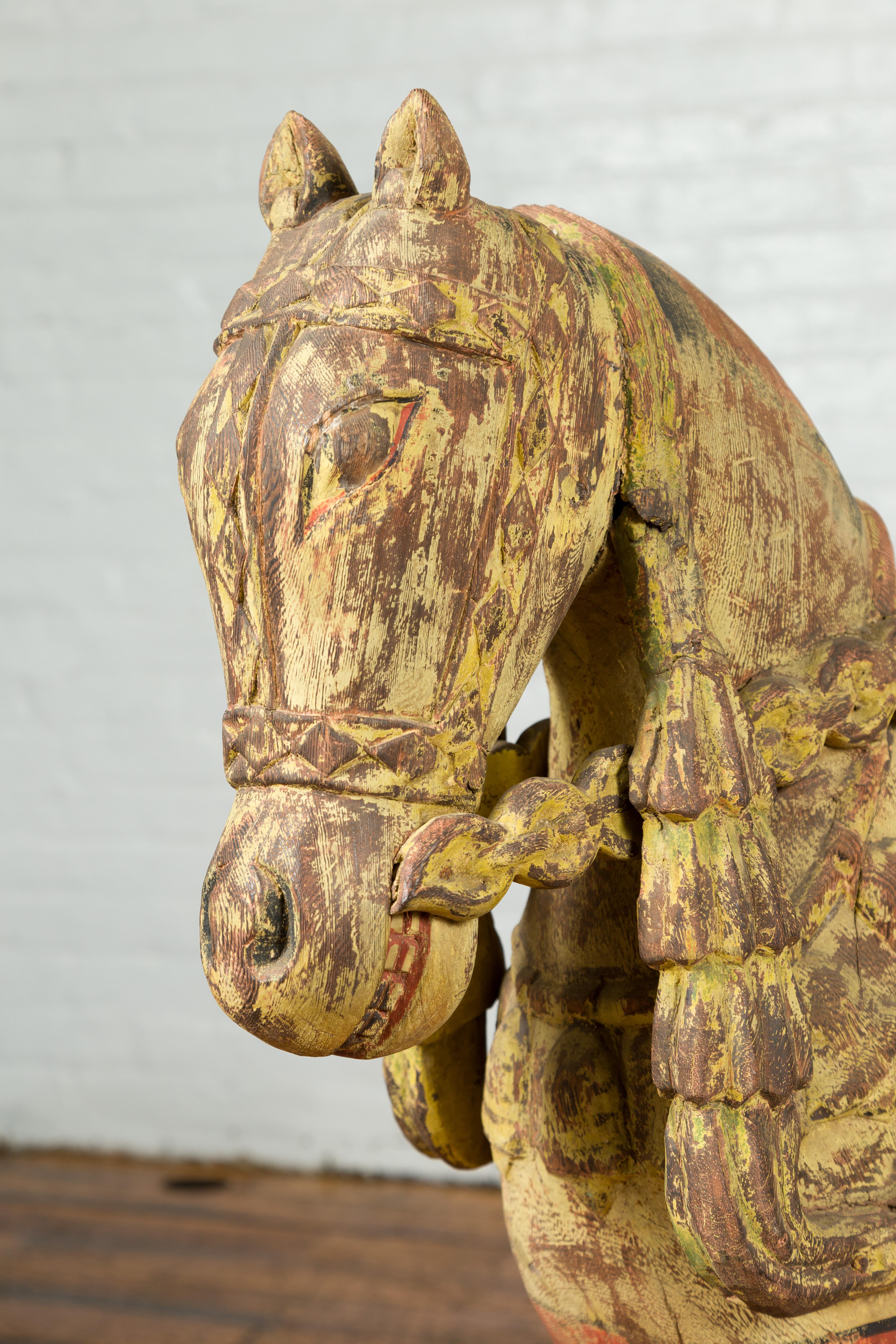 Painted Vintage Indian Carved Wooden Horse from Madras with Yellow and Red Patina For Sale