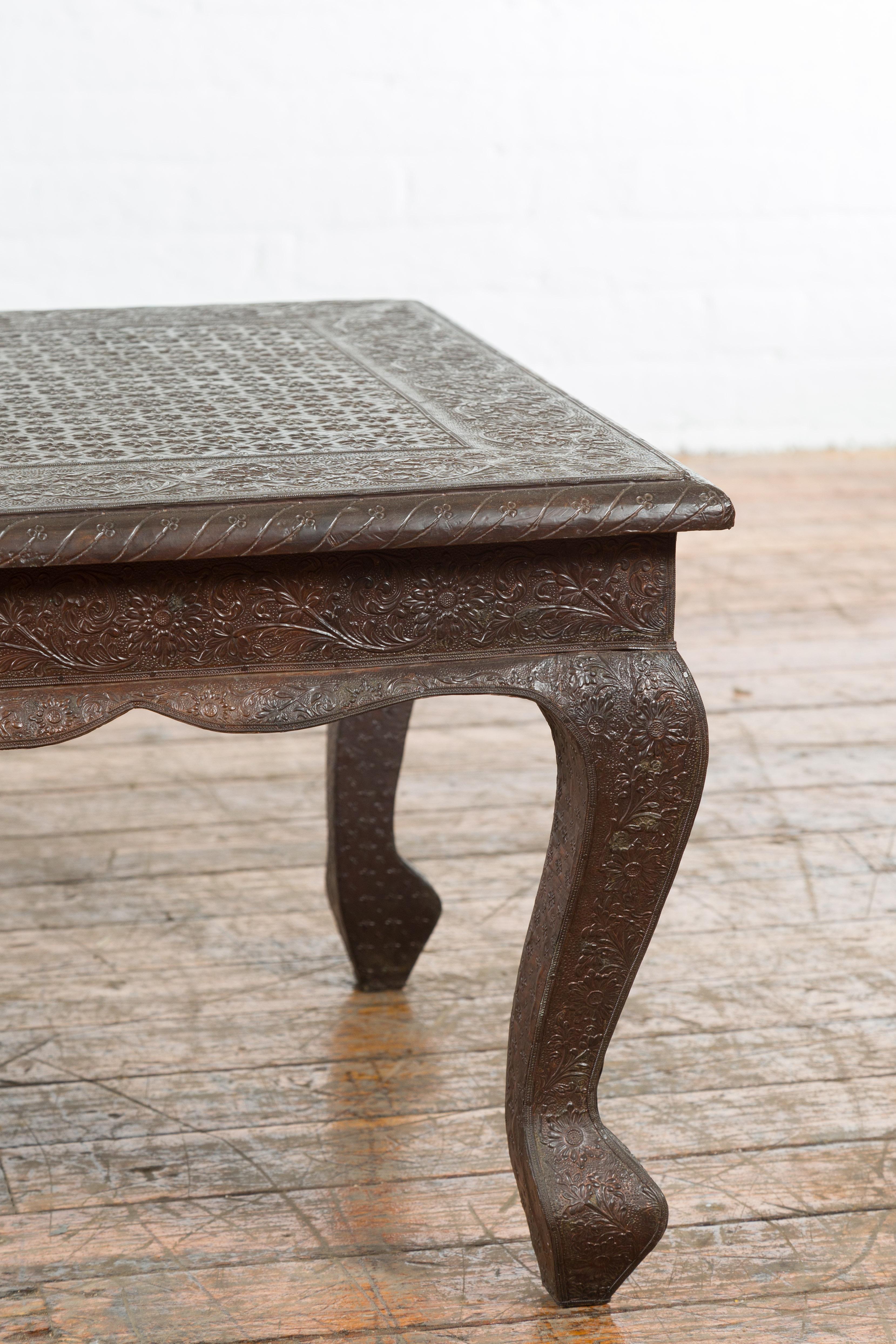 20th Century Vintage Indian Coffee Table with Embossed Floral Design and Cabriole Legs For Sale