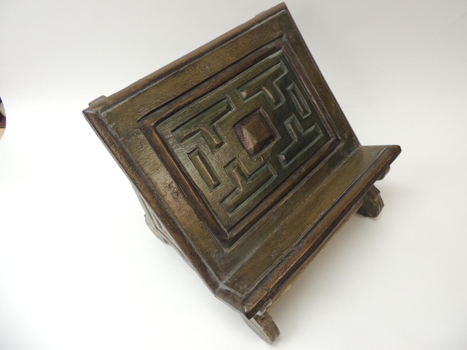 Vintage Indian hand painted and carved wood bookstand or rack.
Carved wood details with rubbed green paint around. Turned wood legs.
Size: 14 x 12 x 12.
 