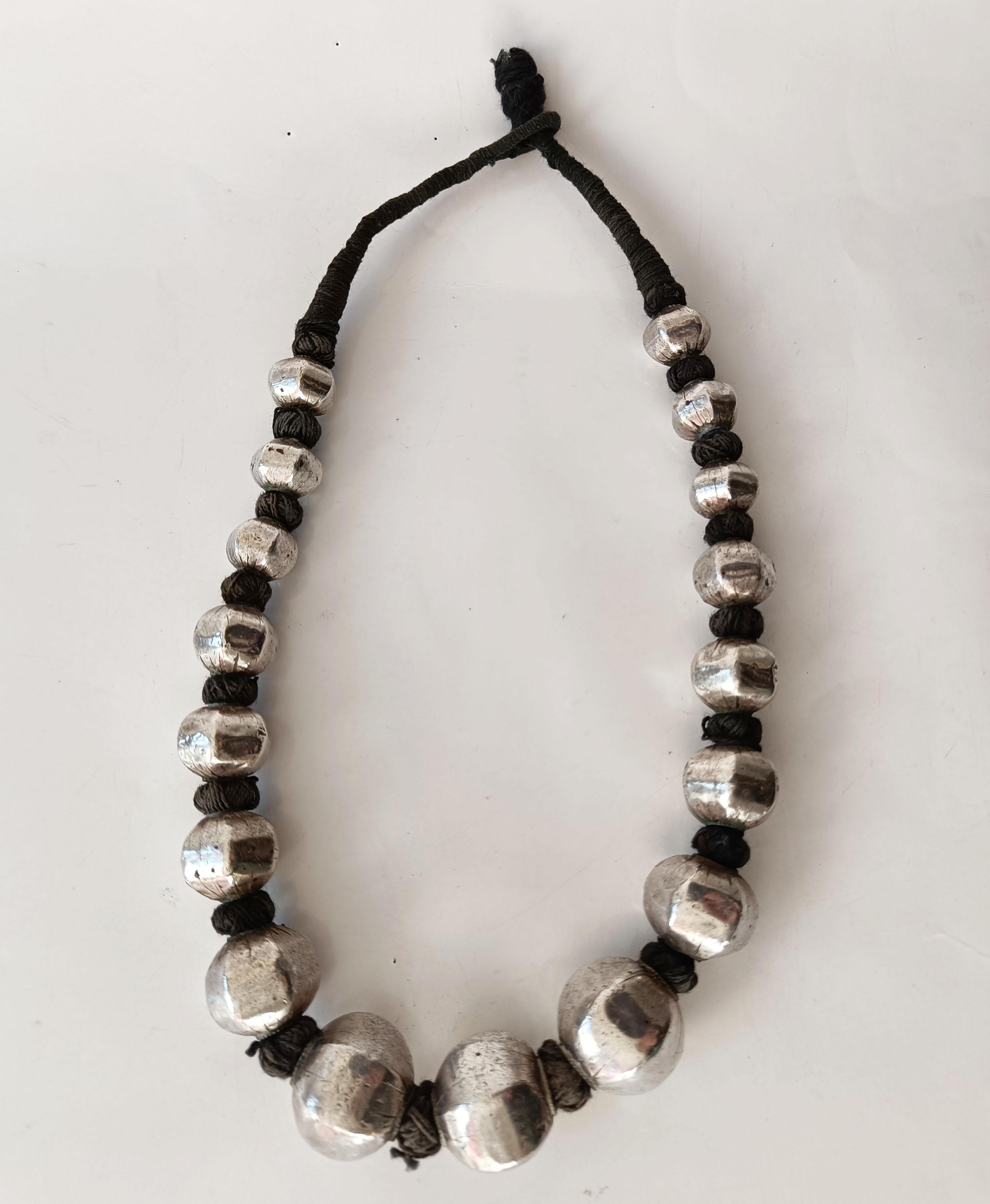 Vintage  Indian large Silver beaded necklace
large silver beads on woven cord 
Darjeeling India early/ mid 20th century
High grade silver. 

Measure: length 58 cm 23.5 inches,  

Period early 20th century.

Condition: Fine.