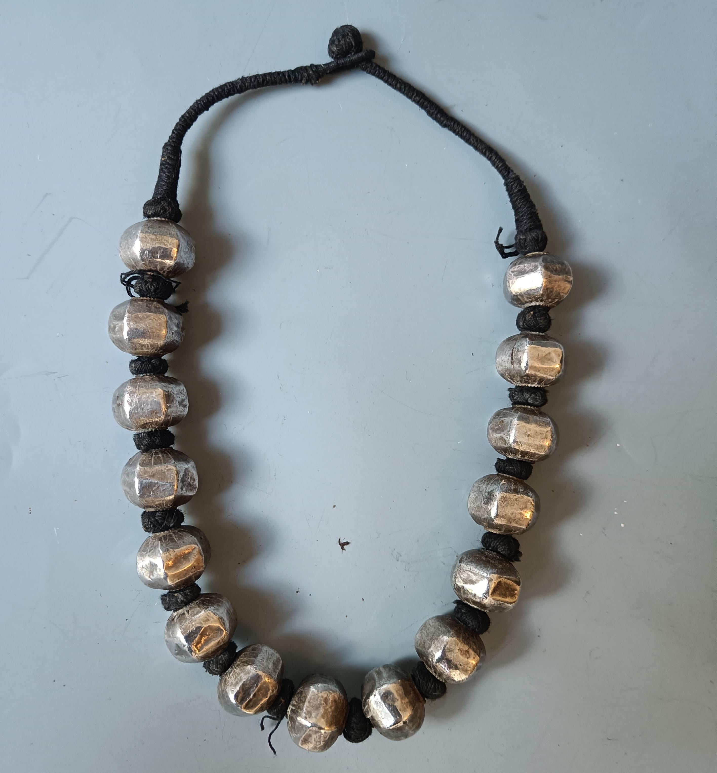 Vintage  Indian large Silver beaded necklace
large silver beads on woven cord 
Darjeeling India early/ mid 20th century
High grade silver. 

Measure: length 58 cm 23.5 inches,  

Period early 20th century.

Condition: Fine.