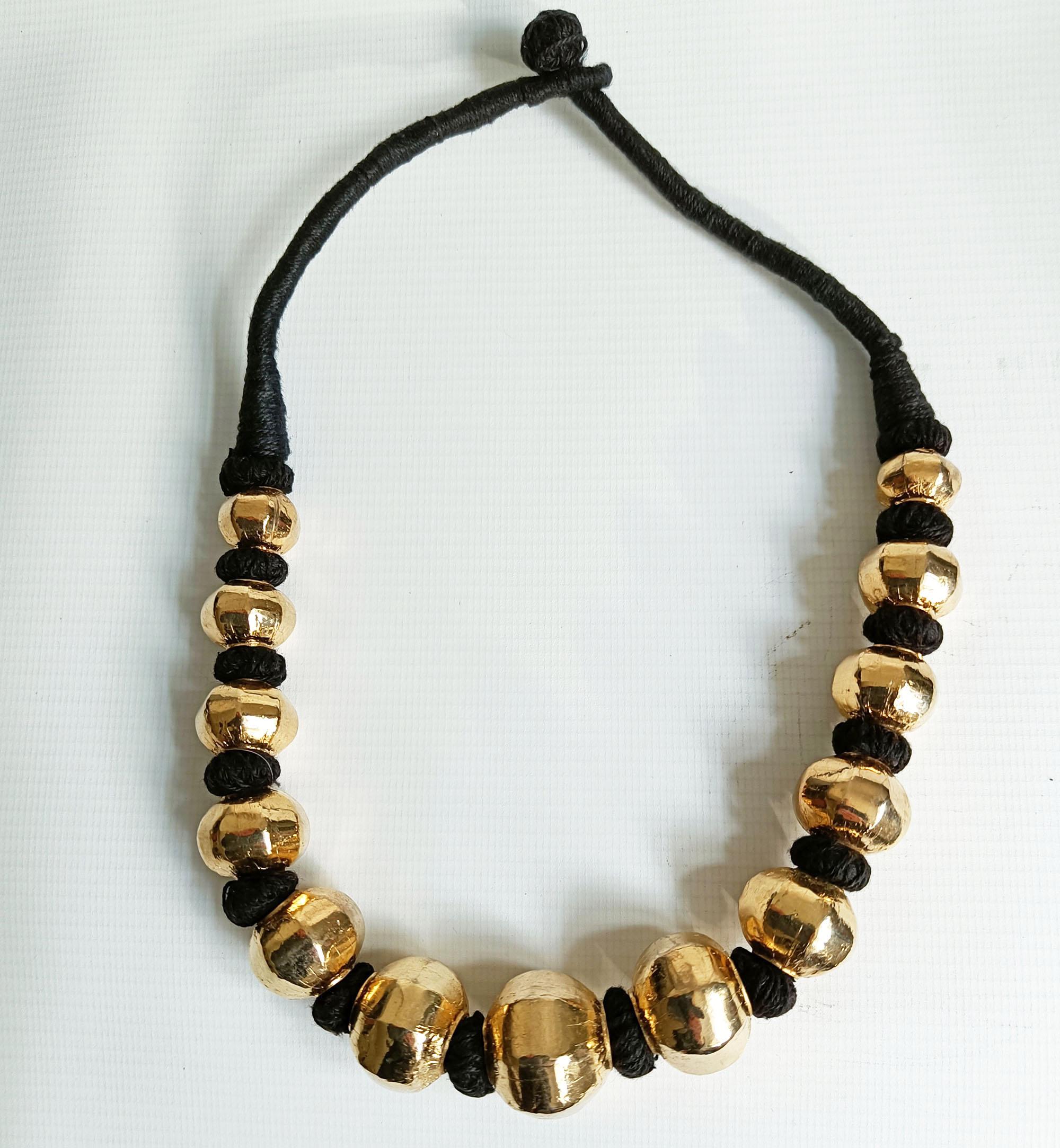 Vintage  Indian large Gold plated Silver beaded necklace
Large wax filled gold plated silver beads on woven cord 
Darjeeling India   20th century
High grade silver with gold plate on woven cord. 

Measure: length 47 cm 18.5 inches,  
 

Condition:
