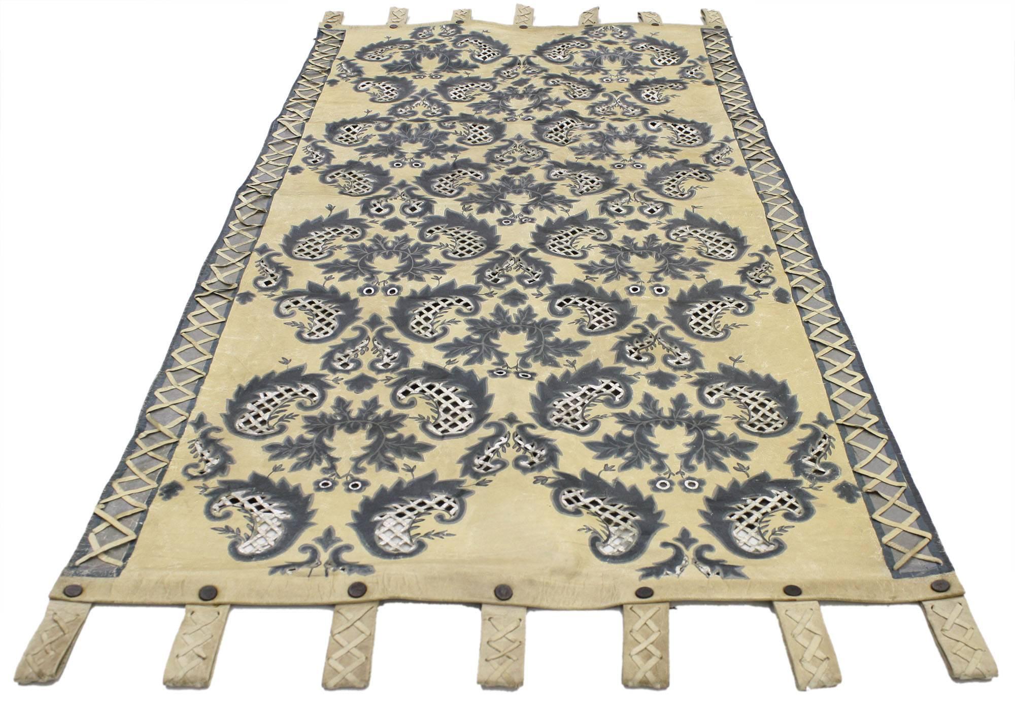 76894, vintage Indian leather tapestry wall hanging with William and Mary style. This vintage leather tapestry beautifully highlights an all-over paisley pattern of boteh motifs and acanthus leaves. The paisley boteh motifs feature a diamond lattice