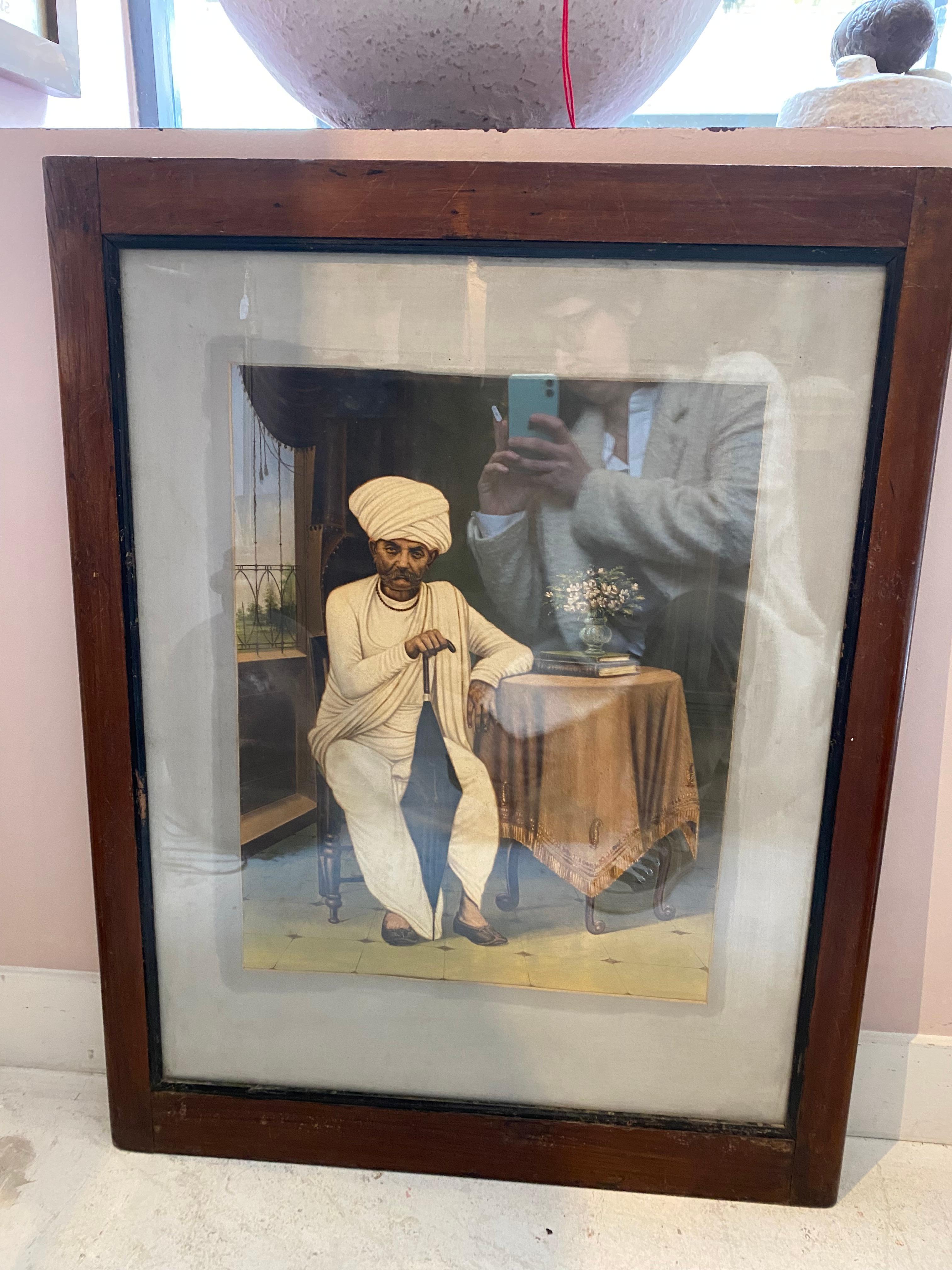 This painting features an Indian Man seated in his  interior. His Traditional outfit show he was an important person.
Painted on paper
Original teak wood teak
Comes from Rajasthan
