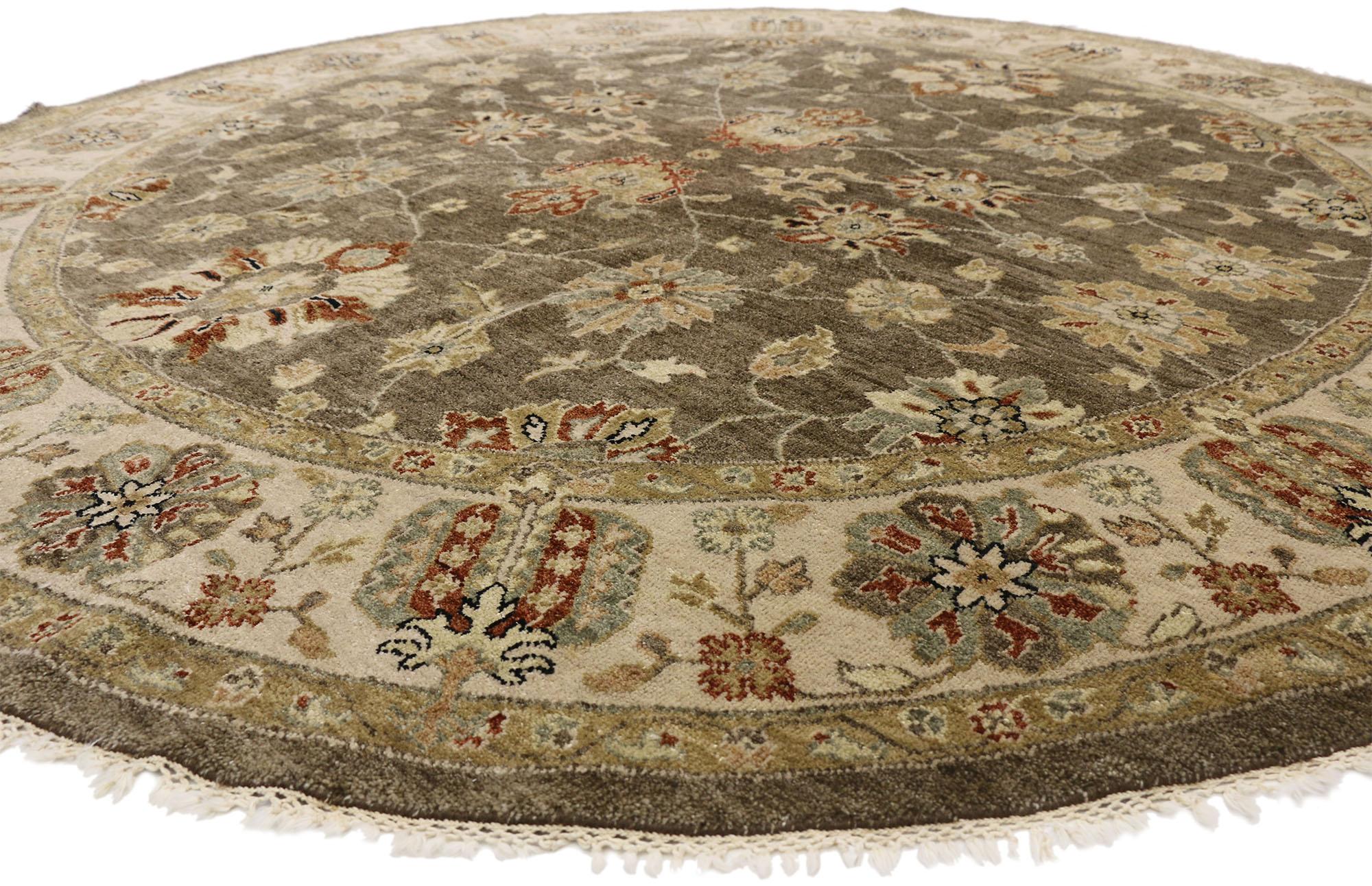77297 Vintage Indian Round Area Rug, Circular Rug with Arts and Crafts Style 08'09 x 08'10. This vintage hand knotted wool Indian round area rug features an all-over floral pattern spread across an abrashed field. Large harshang palmettes, leafy