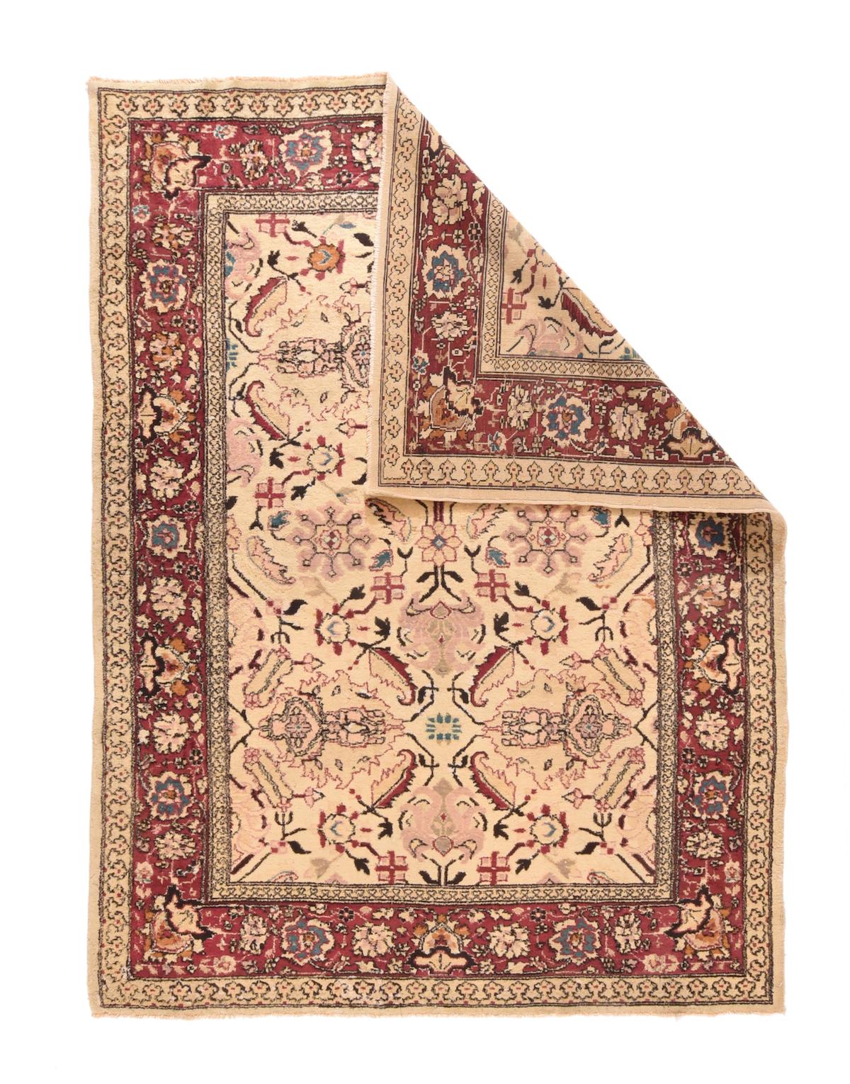 Fine Antique Agra Rug 6' x 7'9''. The sandy straw field shows a vertical double repeat of palmette crosses centred on small rosettes and a slightly larger rosette. Small octogrammes with radiating 