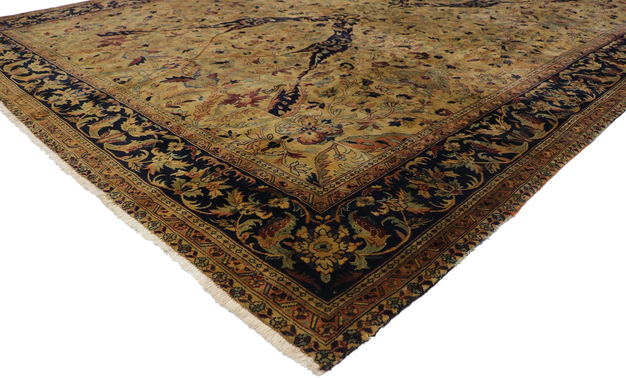 77606, vintage Indian rug with Warm Arts & Crafts style. With its timeless design and warm earth-tone colors, this hand-knotted wool vintage Indian rug astounds with its beauty. It features an all-over botanical lattice pattern composed of blooming