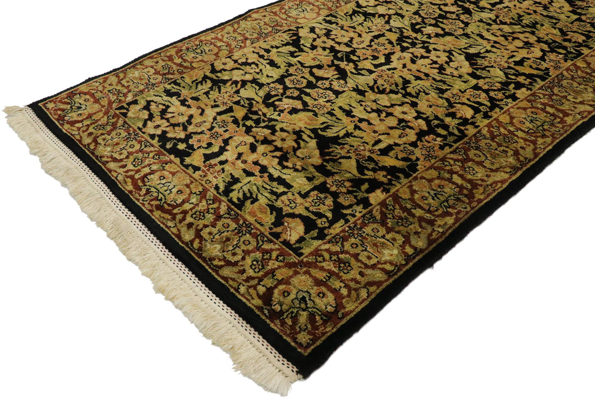 77529, vintage Indian runner with Old World Traditional style. The architectural elements of naturalistic forms combined with a traditional style, this hand knotted wool vintage Indian rug is poised to impress. The abrashed field is covered in an