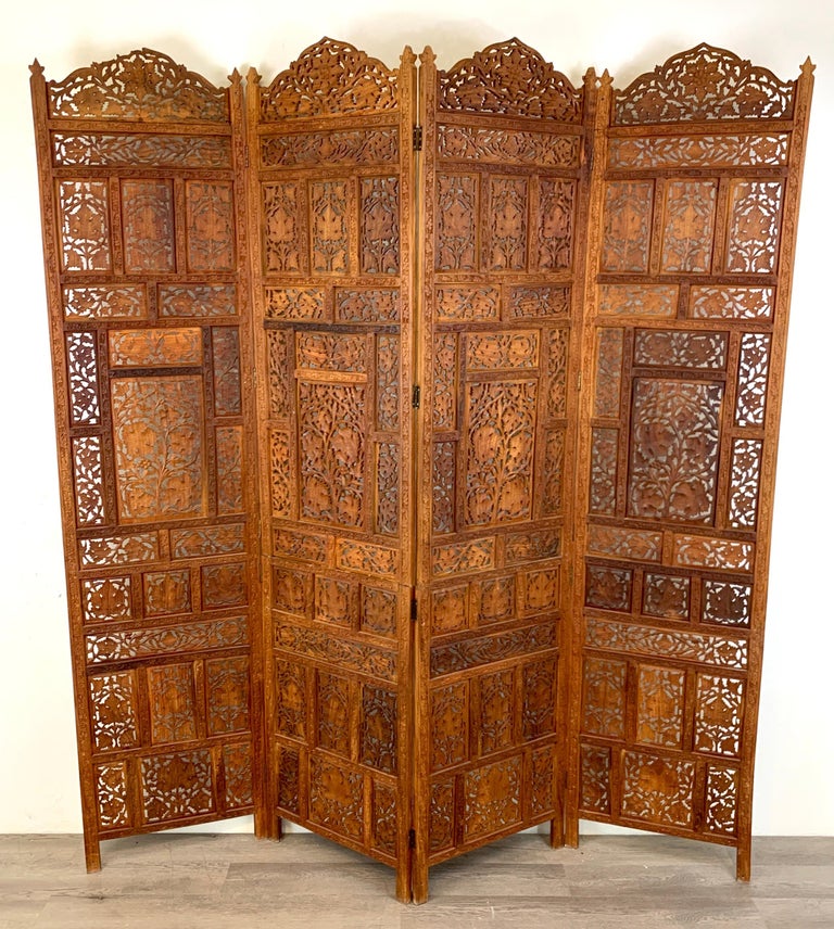 Vintage Indian sandalwood four panel screen, beautifully carved and pierced. Stamped 'Made in India'
Measures: Four 20