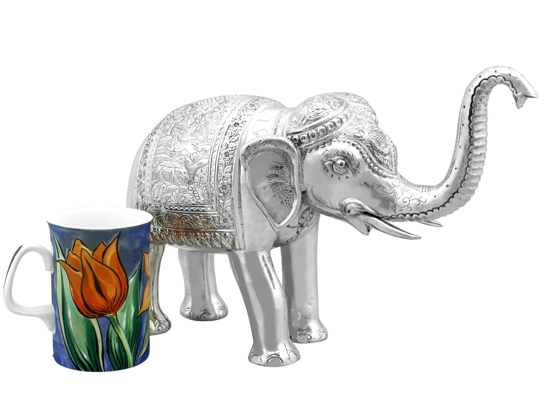 An exceptional, fine and impressive vintage Indian silver table ornament of an elephant; part of our ornamental silverware collection

This exceptional vintage Indian silver ornament has been realistically modelled in the form of an
